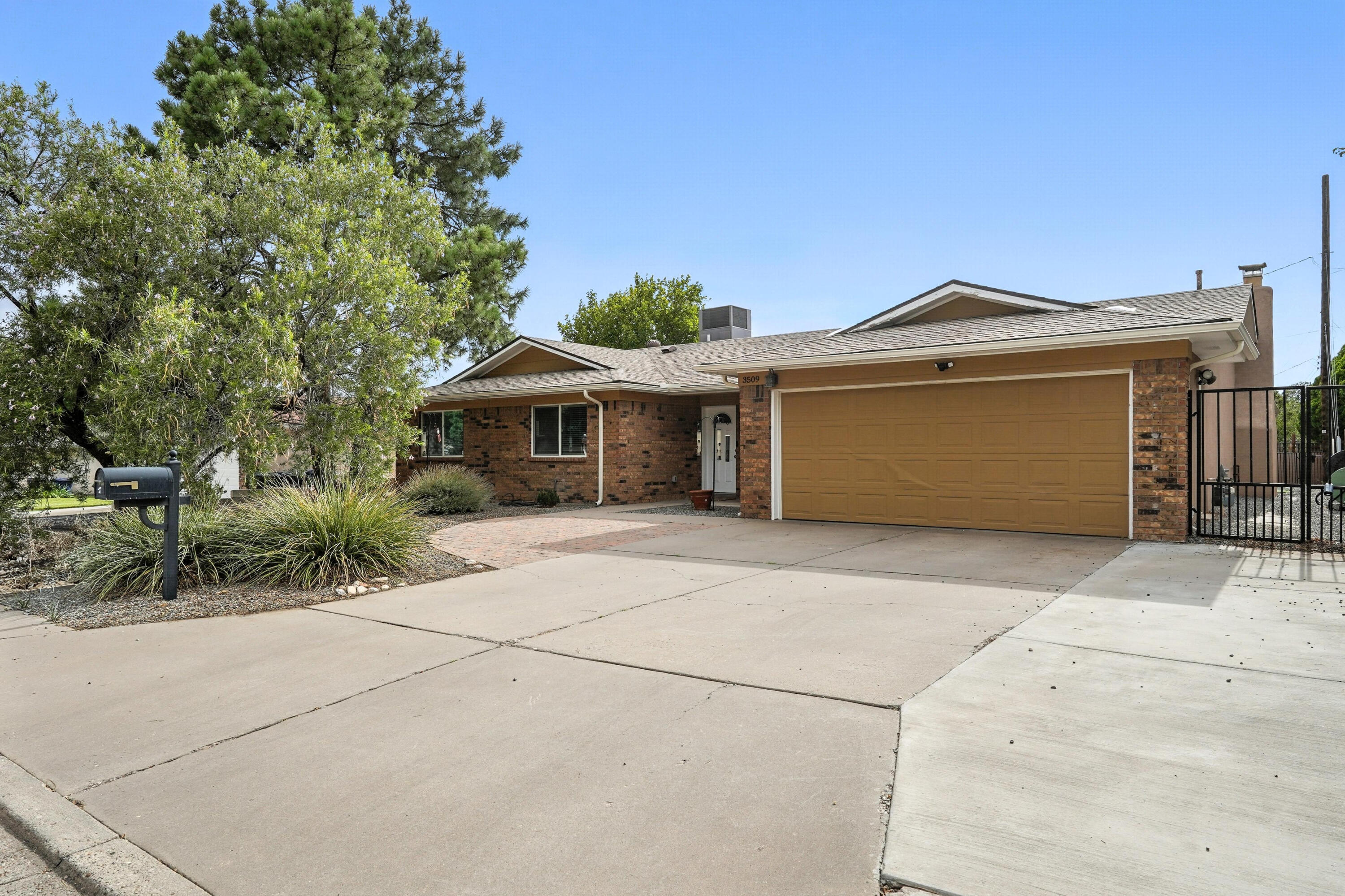 Come see this amazing home on a large lot. The home features a generous primary bedroom and en suite bathroom, two additional bedrooms that include en suite bathrooms too, that's right 3 BEDROOMS WITH A BATHROOM, two other bedrooms in a private hall with the fourth bathroom. The layout of this home is open and inviting while still providing private rooms and bathrooms for it's homeowner. The beautifully done kitchen features granite countertops, newer stainless steel appliances and a breakfast bar. The kitchen appliances and washer and dryer are included. For your furry friend there's a large dog run with a doggy door on the north side of the home. There are some friends with feathers in the backyard that give you the option for fresh eggs too.