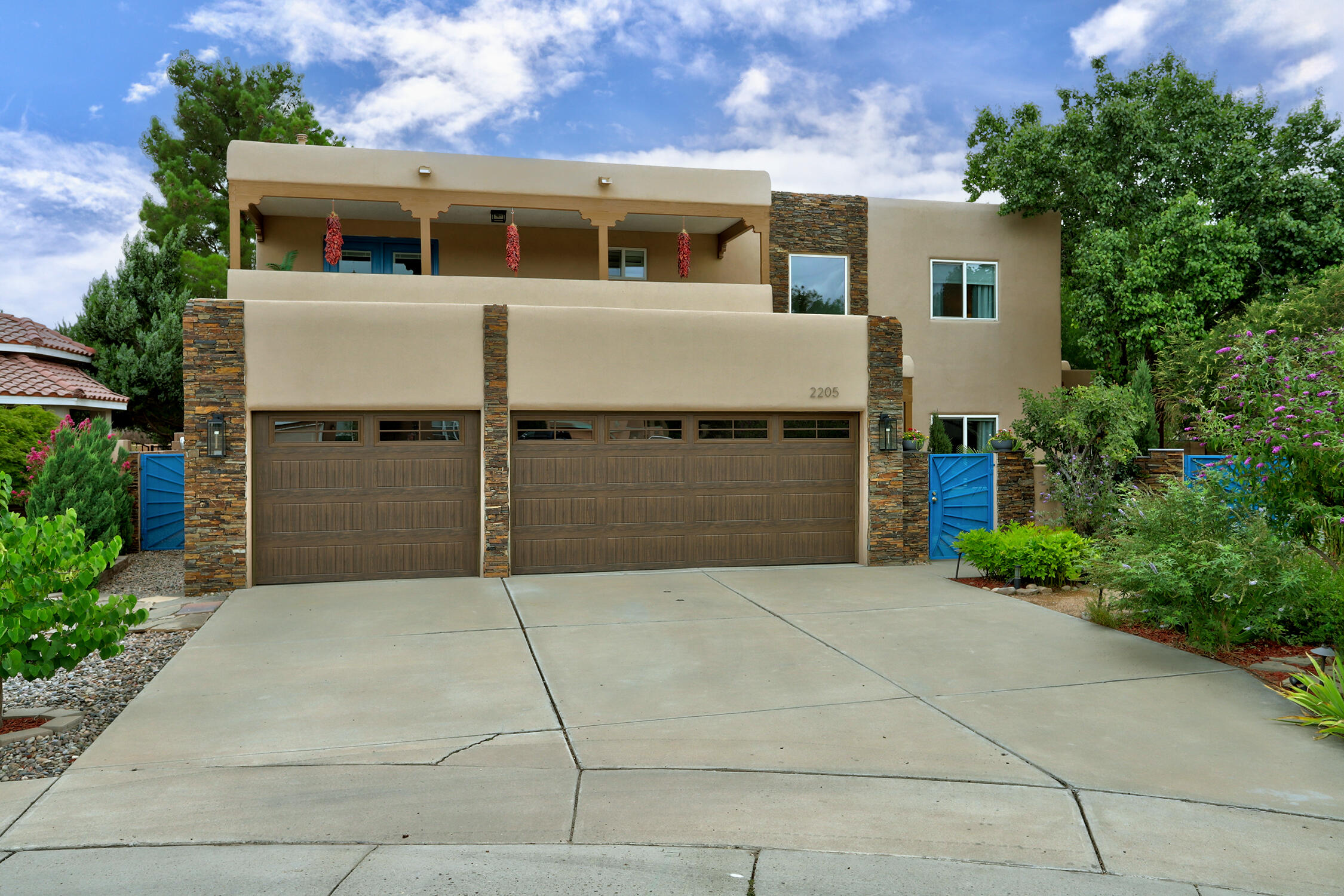 Located in a highly sought after North Valley neighborhood, this dazzling four-bedroom home is a true gem offering elegance and style. A bright entry way greets you as you enter the home. To your right, is the large dining room with a large window that gives the room ample natural light and  views of the private  manicured courtyard. Just off the dining room is the open kitchen with granite countertops, generous cabinet space, and a stunning backsplash. Equipped with gourmet appliances, including a six-burner professional-grade stove, this kitchen is as functional as it is beautiful. The adjacent breakfast nook, featuring a charming bay window that looks out to the homes lush backyard.