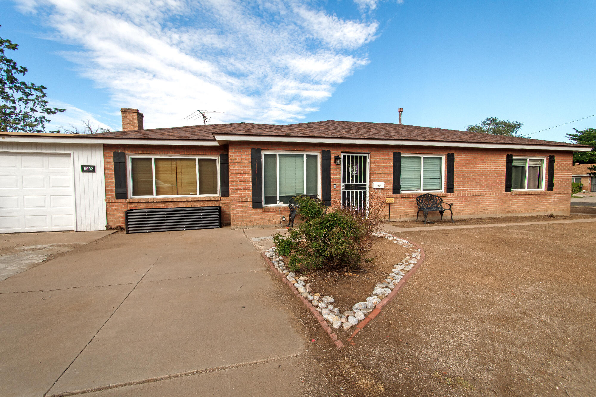 Solid Built Classic Brick 3-Bedroom, 2-Bath Home on Oversized Lot in Desirable Hoffmantown! Offering timeless charm and thoughtful updates throughout. This inviting property sits on a generous lot in the heart of Albuquerque. Inside, enjoy a bright &  functional layout with upgraded stone accents in the kitchen & refreshed bathrooms featuring new mirrors & lighting. A large screened-in porch extends your living space. New exterior shutters add curb appeal, & the home offers ample off-street parking, ideal for multiple vehicles or an RV. The expansive backyard provides endless potential for gardening, recreation, or even adding a workshop or possible casita? Conveniently located near parks, shopping, dining,EZ I-40/airport access--this home combines durability, style, & location all in one.