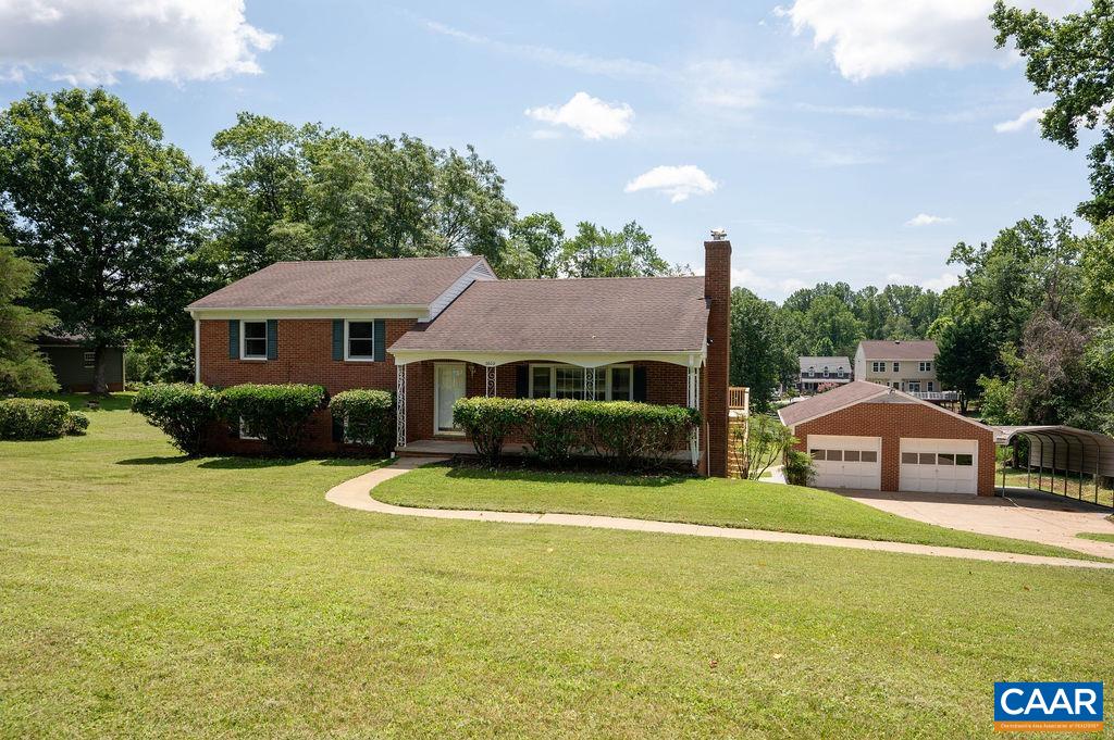 The perfect location and the perfect family home! This classic brick tri-level on a basement in convenient Northfields is minutes from UVA, and NGIC. Solidly built, the basics have all been updated, including a new fridge, newer roof, a new deck, wood floors refinished, and more. The furnace flue was just replaced.  Although it is multi-level, the home has a normal entrance onto the first floor, which offers a spacious living room, kitchen, dining and glassed-in sunroom. Upstairs, there are three bedrooms and two baths, and downstairs is the laundry, another bedroom, bath and a large paneled den.  There's a very large, free-standing garage, as well as an original single-car garage. Huge lot to enjoy.