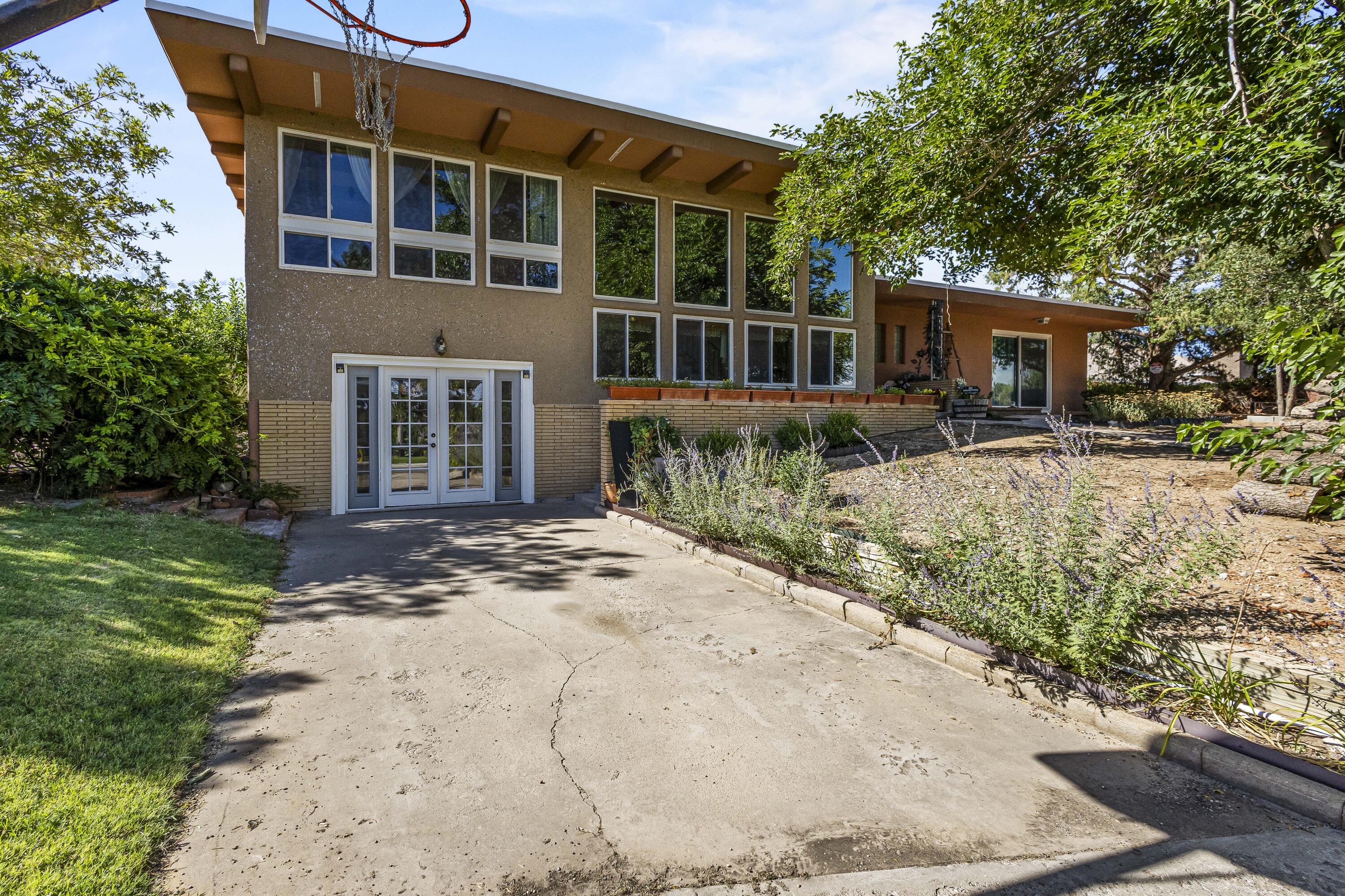 Discover this delightful split-level contemporary home in beautiful Paradise Hills! Set on a tranquil circle drive, this residence offers fantastic mountain views and a park right across the street for outdoor enjoyment. Inside, you'll find two cozy living areas--the lower level could even be transformed into an additional bedroom or office space. The expansive half-acre lot features a garden area and convenient RV parking, making it ideal for those who love to explore the outdoors. With a detached two-car garage and recent updates like a new roof and refurnished stucco, this home combines comfort with practicality! You'll wat to see this one for yourself.  This unique property is a gem!
