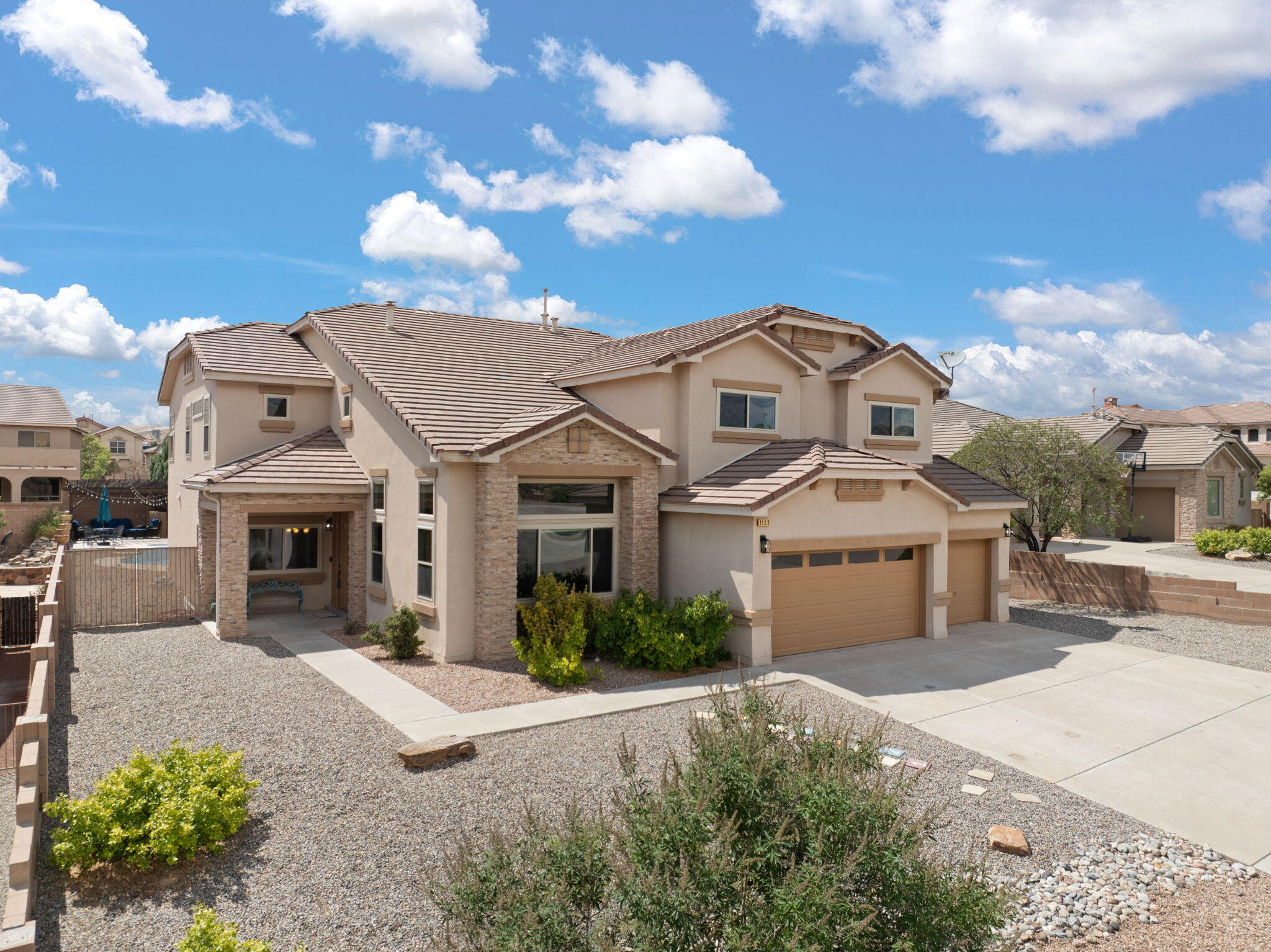 Stunning fully remodeled 4,173 sq ft home on a 0.28-acre lot in Rio Rancho! Features 4-5 bedrooms, 3 beautifully updated bathrooms, and a spacious layout with new flooring, fresh interior paint, and energy-efficient double-pane vinyl windows. The kitchen boasts all-new cabinetry, hardware, and stainless appliances. Enjoy a private 13,000-gallon heated pool, jetted hot tub, and a gas fire pit with incredible views. The dedicated office includes custom built-ins. Garage provides ample storage, plus side gate access for added convenience. A perfect blend of indoor luxury and outdoor living--move-in ready!