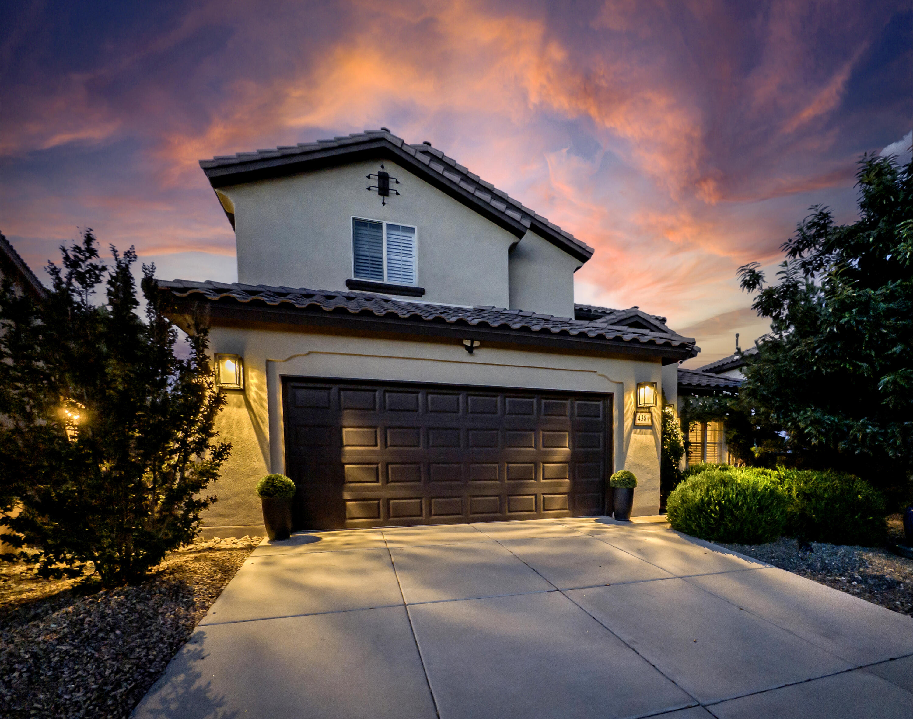 Shimmering Sandia views meet tranquil beauty in this 3,063 sq ft 5BR/4BA sanctuary. RARE 1st flr/2nd BR w/Full BA. All NEW synthetic stucco. Backyard is a serene outdoor retreat w/expansive stamped patio, fire-bowl lounge, lush landscape & raised privacy walls. Inside awaits a formal dining room, granite counters, Canadian hardwood & Couristan carpeted floors + 3 fireplaces, including the elegant Primary Suite's custom Kiva. Gourmet kitchen enchants w/Bosch appliances, glittering backsplash, spacious lit cabs & pantry. Custom window treatments, chandeliers & designer lighting add luxury, while full security, irrigation & new water softener systems + 5 walk-in closets offer practicality. Boxwoods, roses & graceful fountain ensure lasting curb appeal. A stunning gem~SHOWS BETTER THAN NEW!