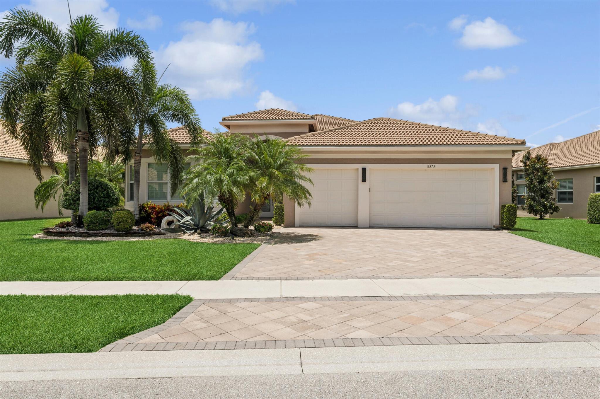 Don't miss your chance to own one of the best homes with some of the best views in the community, hands down! This beautifully-kept Julia model boasts 3 ensuite bedrooms, a den, and 3.5 baths with an open-concept family room/kitchen that will make you the home to visit! Continue the entertaining outside on the wonderfully designed pool area with a pool with sun shelf, water features, and a HUGE spa. Cook anytime on your built-in outdoor kitchen on the covered patio behind the electric hurricane screen and enjoy NO NEIGHBORS behind you. 3 car garage, large walk-in master closets, master bath with tub and shower. Use the den as an office or another place to gather and relax. Laundry room inside. Beautiful tray ceiling in living room and master and crown molding throughout! Must see!