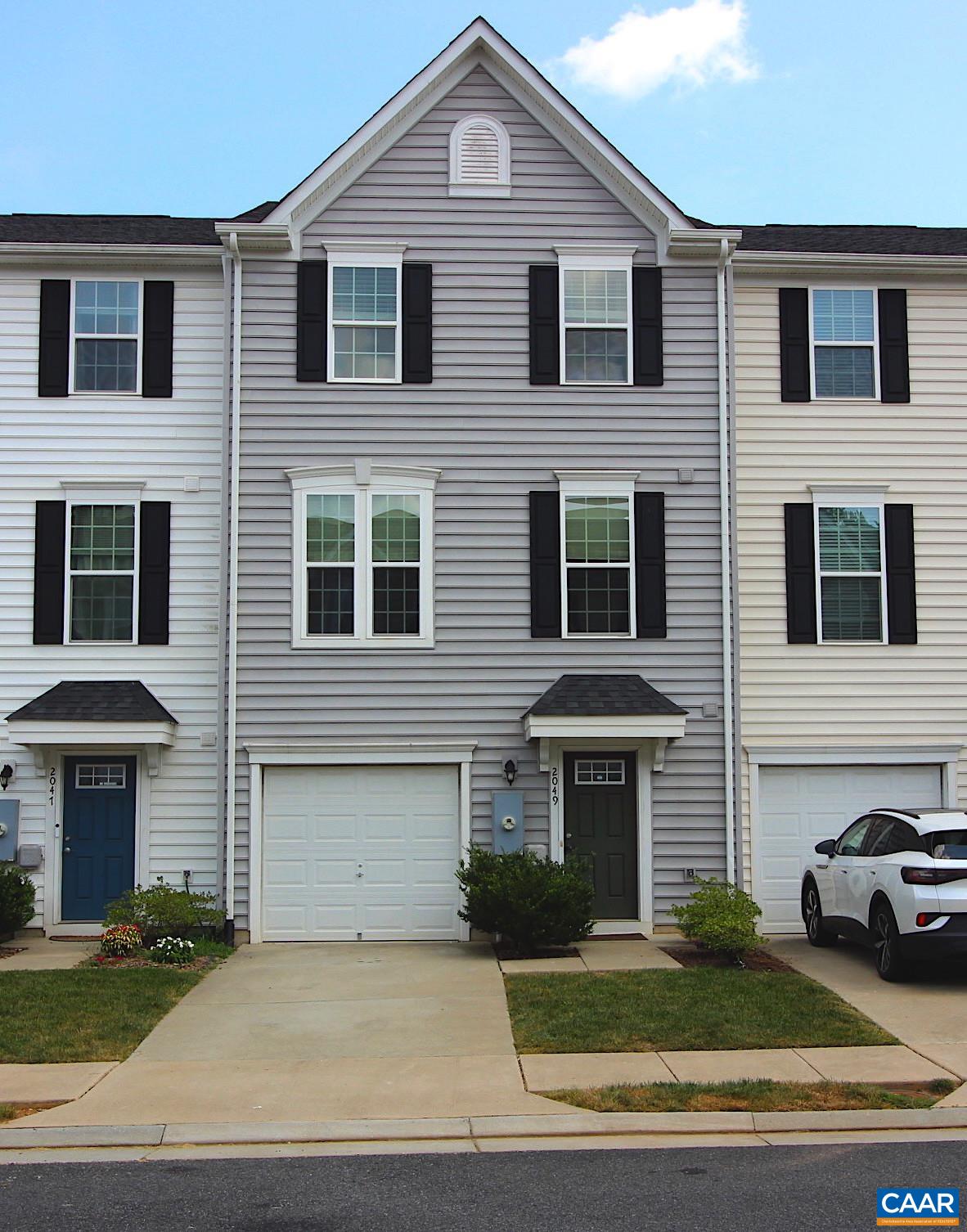 OPEN SUNDAY 8/10/25 1PM-4PM This fantastic 3 Bed, 2.5 Bath townhome with mountain views is now available in Riverwood! Enjoy a spacious primary suite with tray ceiling, brand new carpet, and laundry room on the bedroom level. The main living level boasts an open floor plan with granite in the kitchen and an oversized island, maple cabinets, gas stove and LVP flooring. Upgraded low maintenance composite decking has stairs (rare in this community) leading down to the fully fenced back yard and a stunning bluestone patio. Terrace level garage access and a rough in for a future powder room offer convenience and potential, and the stained concrete floor is perfect for a home gym or game room. With off-street parking, HERS® rated energy efficiency, and convenient to the N29 corridor, NGIC, CHO, shopping, UVA and downtown Cville, don’t miss this move-in ready townhome!