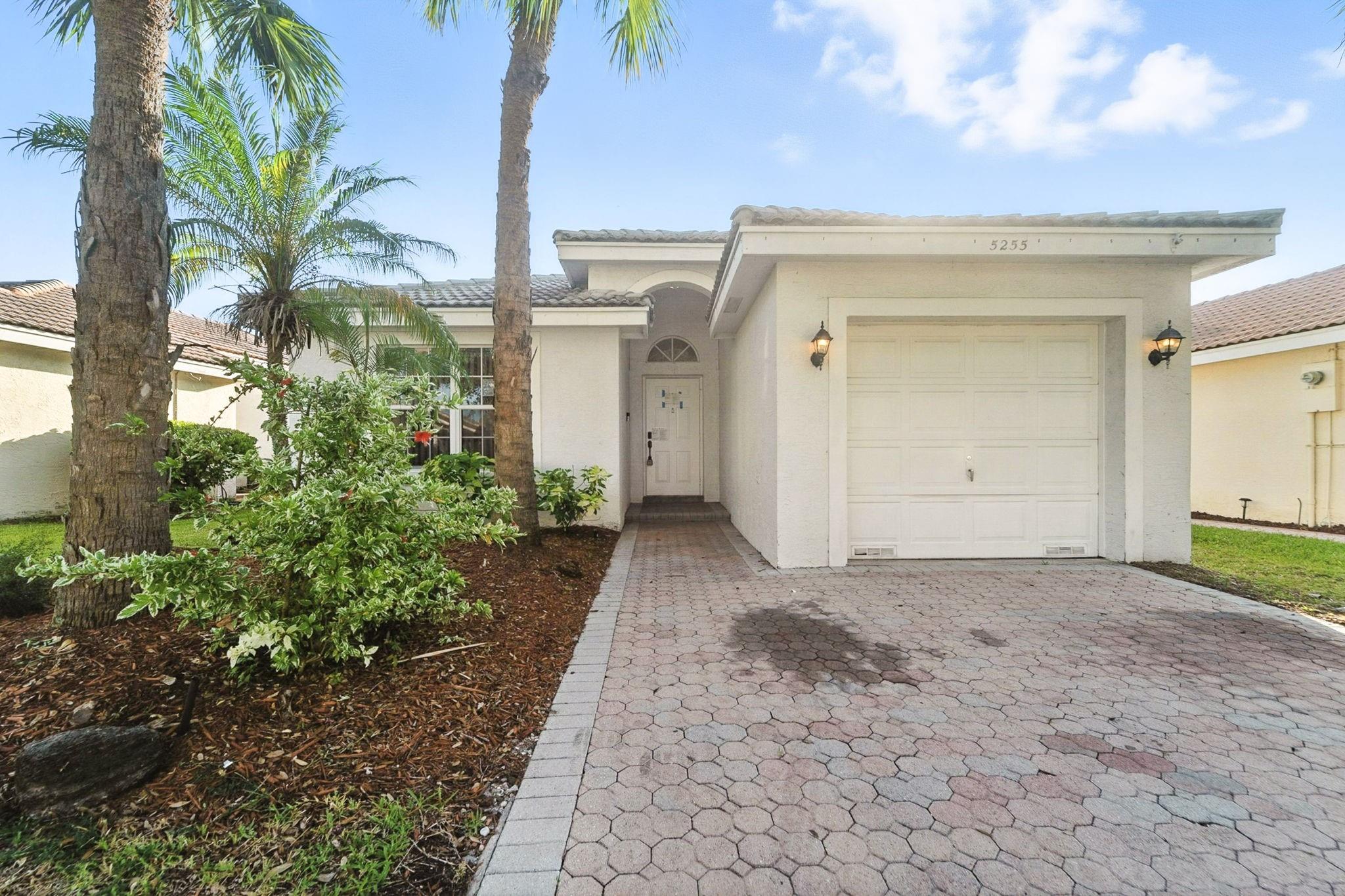 This charming 1-story home features 3 bedrooms, 2 bathrooms, and a 1-car garage. Enjoy an open layout with a kitchen bar perfect for casual dining, stainless steel appliances, and a bright, inviting interior. Step out to the enclosed lanai back porch—ideal for relaxing or entertaining. Schedule a showing today! One or more photo(s)  have been virtually staged.