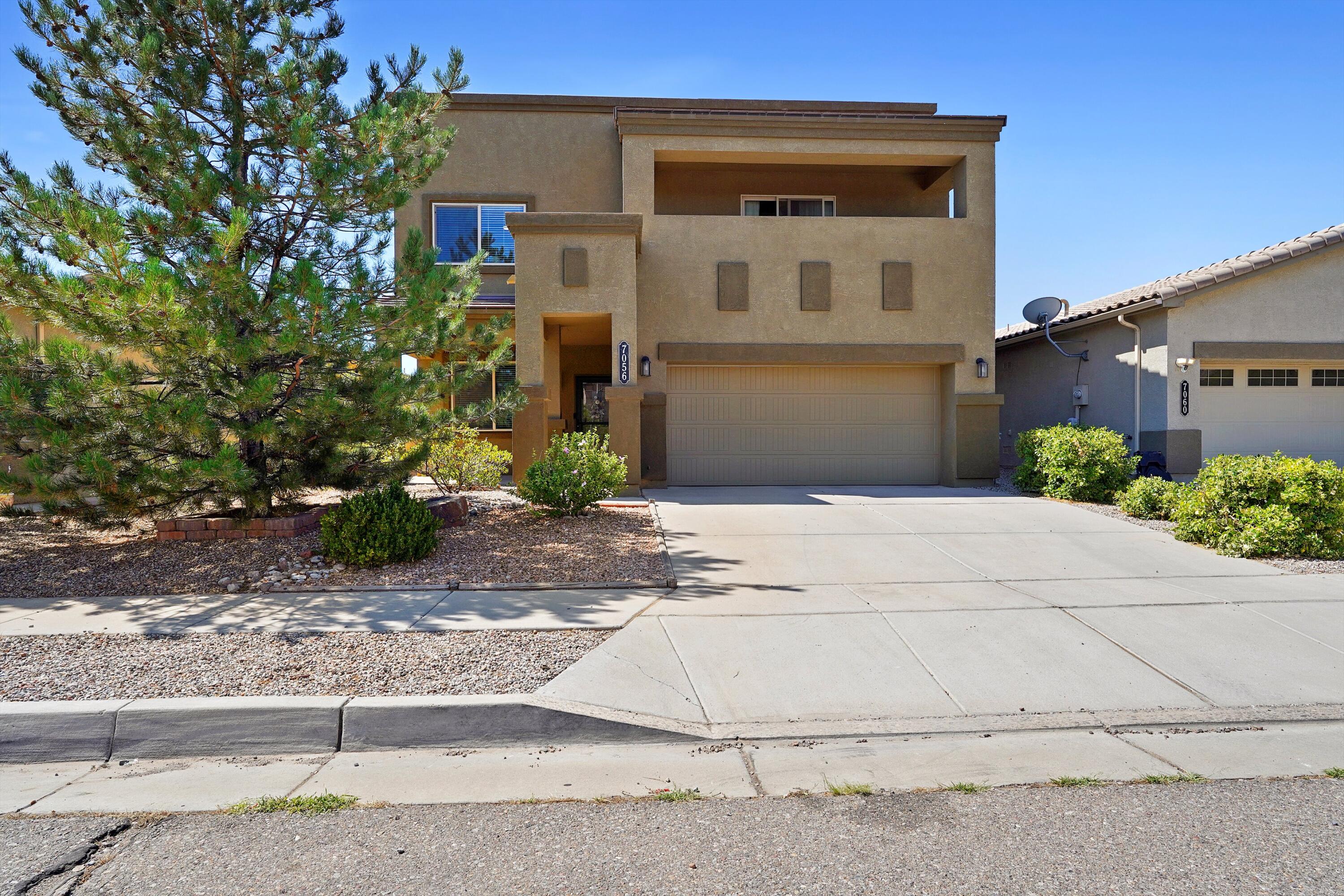 Welcome to this well cared for 4 bedroom home offering comfort, space, and an ideal location near Paseo Del Norte, the Petroglyphs, and miles of scenic walking and biking trails.Inside, you'll find a functional and inviting layout filled with natural light. The kitchen features granite countertops, stainless steel appliances, a white subway tile backsplash, and a walk-in pantry blending style and practicality for everyday living. The main living and dining areas flow seamlessly, offering plenty of space to gather or unwind.