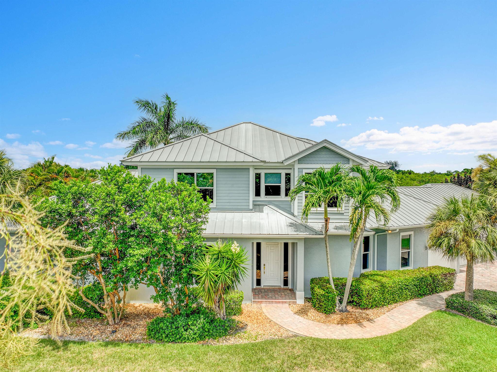 Boat enthusiasts that enjoy entertaining this custom built luxurious waterfront home has everything you need. interior of this home has custom woodwork that accents high ceilings and distinctive stairway. Bright and airy open plan is surrounded with multiple  oversized windows. For the chef in the family an oversized 24x17 kitchen w/ island & breakfast nook. French doors that open to patio water view, Tiki Hut & Pool area. Only steps to Dock w/ Boat Lift.  Three car Garage equipped with Charging Station. Large Master bedroom 1st floor & ensuite has it's own covered private patio. Upstairs Three bedrooms with a sitting area have gorgeous Mahogany wood floors. Keep the lights on with a Whole house generator. A must see to appreciate.  Never so much for this price. Small Privet Community ...