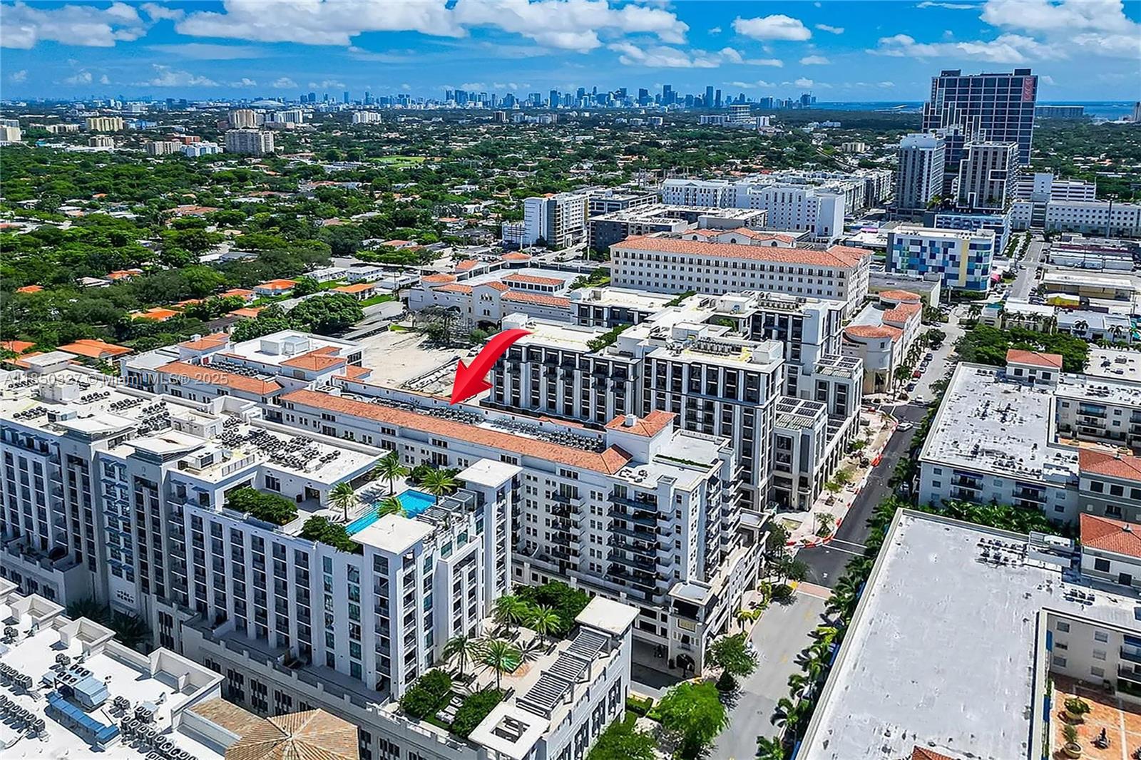 Welcome to One Village Place. This 2 bed, 2 bath unit features a den and 2 parking spaces. The open-concept kitchen has wood cabinets and black granite countertops. The split layout offers a den that can be used as a 3rd bedroom or office. The unit is bright and spacious with stainless steel appliances and granite countertops in the kitchen. It also has beautiful wood floors and a large master bedroom with 2 walk-in closets. Conveniently located close to the elevators, the building's amenities include a heated pool, fitness room, billiard room, 24/7 security, and jogging path. You can walk to the shops at Merrick Park and Landmark Theatres, and there's a trolley service to Miracle Mile