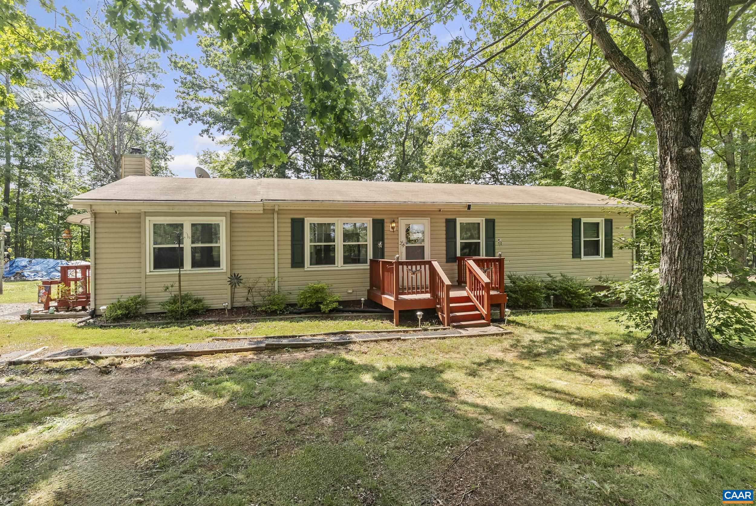 Nestled on a picturesque country road in southern Albemarle County, this well-maintained home offers peace, privacy, and modern comfort. Inside, the home boasts numerous updates including insulated windows and doors, a modern HVAC system, a newer hot water tank, and a cozy free-standing wood stove. The shaded yard is dotted with mature trees and features several outbuildings perfect for storage, hobbies, or workspace needs. This property is ideal for those seeking a quiet rural lifestyle without sacrificing convenience or comfort.
