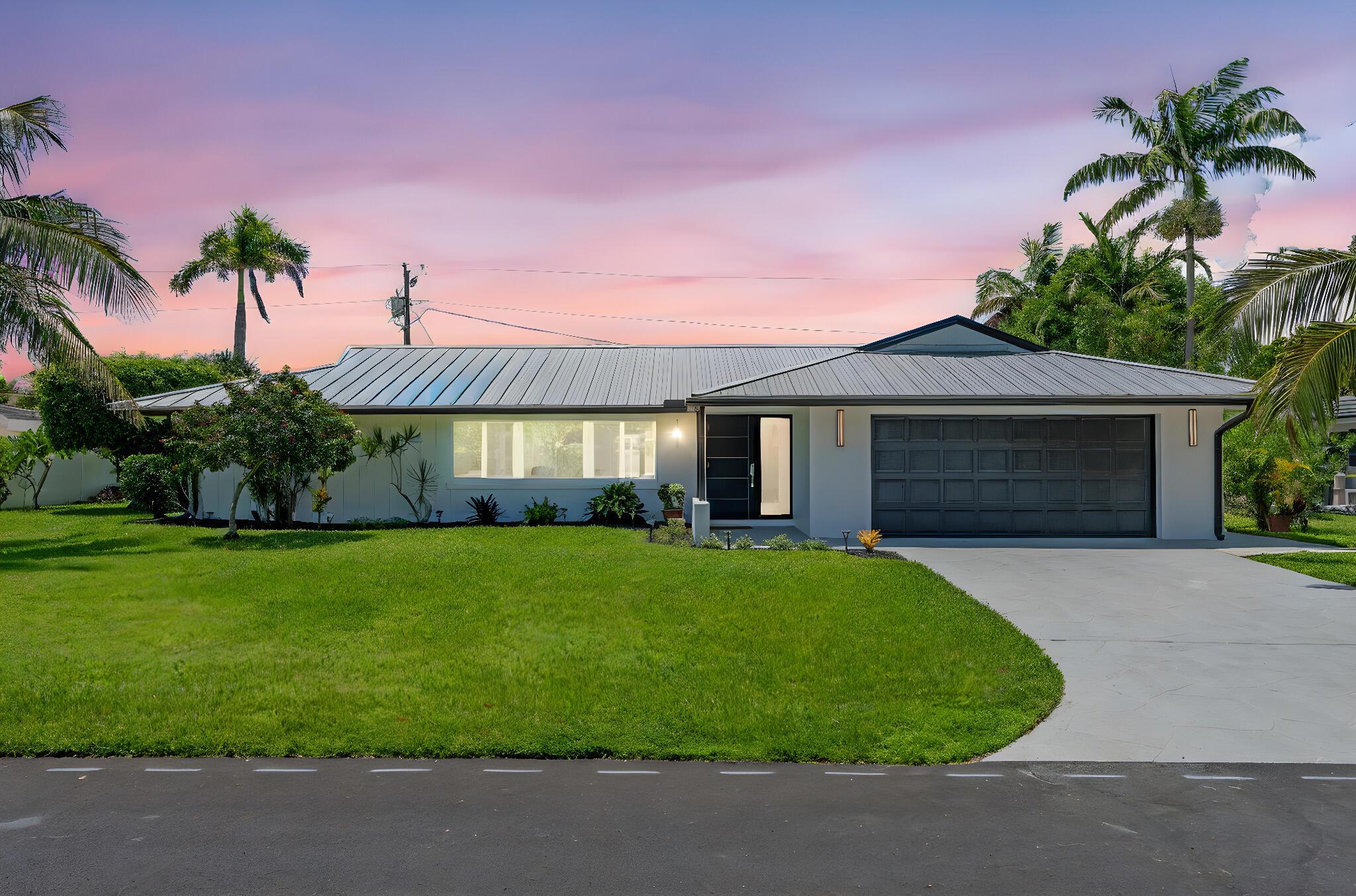 Welcome to 1081 Bimini Lane -- the perfect combination of elegance, entertainment, and joyful relaxation. This beautifully renovated 3-bedroom, 2-bath open-concept home is nestled on the coveted Singer Island, just steps from the beach, scenic finger canals leading to the Intracoastal, and an array of shops and restaurants. Step into a bright, spacious living area filled with natural light and brand-new flooring throughout. The luxuriously remodeled kitchen features sleek European-style cabinets, quartz countertops, stainless steel appliances, an expansive peninsula, and a touchless faucet -- all seamlessly connected to the dining area and a stunning elegant wine wall. Two lazy Susans add thoughtful functionality. An entertainer's dream! The master bedroom is spacious and airy, with... a private entrance to the pool area. The ensuite bathroom is its own retreat, featuring a luxurious oversized shower, separate soaking tub, double-sink wood vanity with built-in storage and electric, and a massive walk-in closet. Enjoy Florida living at its finest with a newly renovated pool (resurfaced in 2025) nestled inside a large screened-in patio, now featuring a gorgeous travertine pool deck. The expansive covered outdoor area includes Bluetooth speakers, ceiling fans, and light fixtures &#x14; ideal for year-round entertaining. Step beyond to discover a peaceful Zen Garden &amp; fire pit, making this home feel like your very own private resort. A bright, private office with its own exterior entry off the living room offers a serene workspace flooded with natural light. Additional features include: a metal roof, impact windows and doors throughout, a whole-home backup generator, and an outdoor shed for added storage. Don't miss this rare opportunity to own a luxurious island retreat on Singer Island &#x14; a perfect blend of sophistication, comfort, and coastal charm.