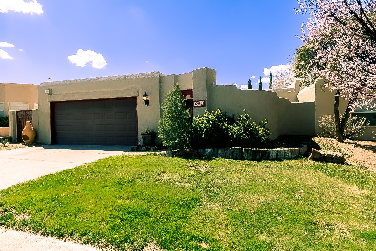 Southwest style home In Tanoan Ready For New Owners! This home has had a make over! Wonderful courtyard entry that leads you inside this stunning home. Living/Dining area is separated by adobe accent walls. The beautiful wood beam viga ceilings in the living area & custom Kiva fireplace adds the perfect ambiance. Kitchen features granite counter tops, gas stove, built in micro, dishwasher & fridge. skylight, pantry, breakfast bar & nook. Owners suite offers Kiva fireplace, walk in closet & double sinks in the 3/4 bath. Covered back patio includes gas stub and extended open patio area. Numerous Improvements over the last 5 years include HVAC, water heater, garage door opener & patio doors.  Owned solar. Oversized garage. Don't miss out, this home won't last long.