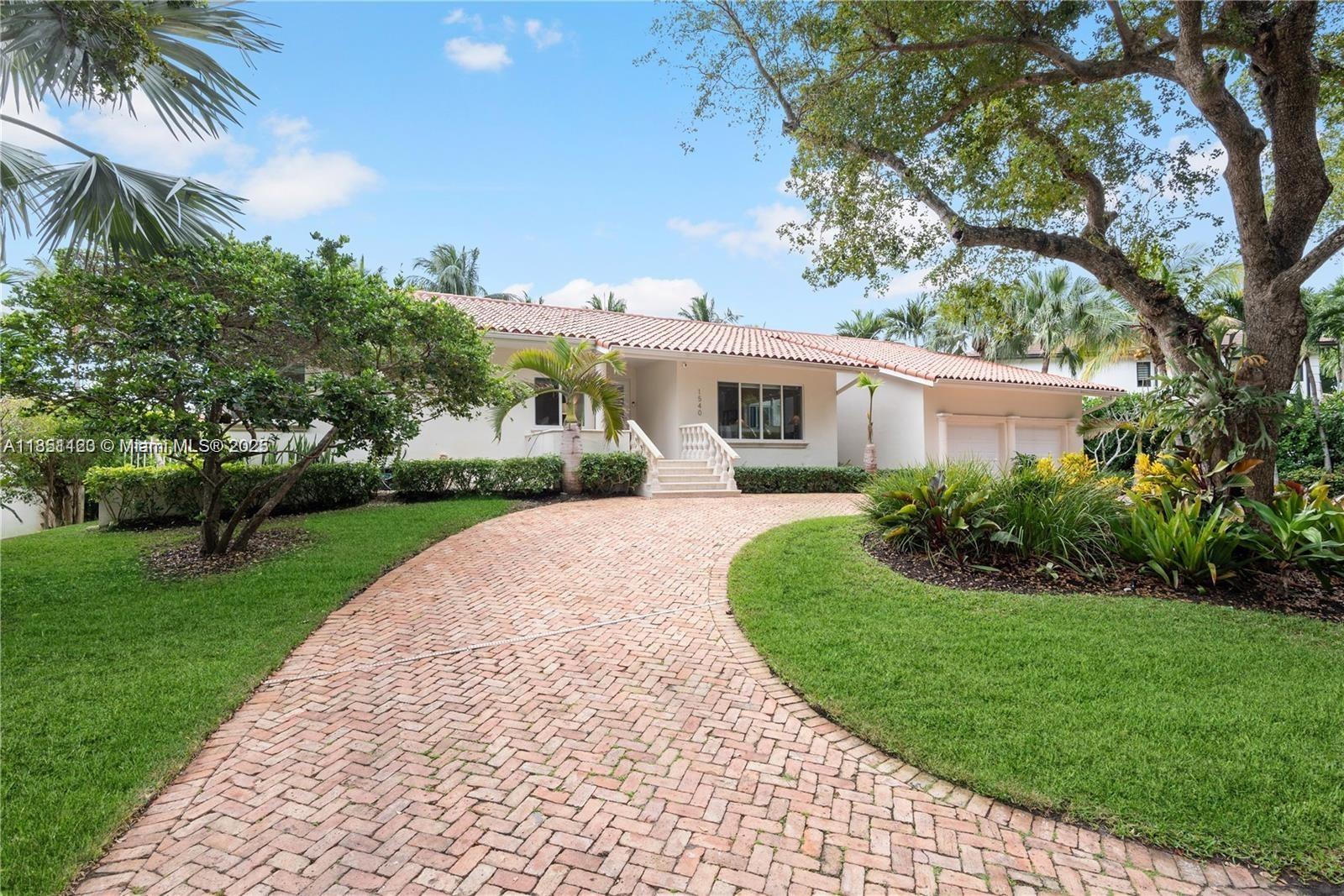 Welcome to your waterfront oasis in the prestigious, guard-gated community of Gables by the Sea.  Nestled on an elevated 12,633SF lot, this 4-bedroom/2.5 bath residence seamlessly blends elegance, privacy and resort-style living.
Step inside to travertine and rich hardwood floors throughout, exuding warmth and architectural character.  The updated kitchen overlooks the pool and canal-perfect for entertaining family and friends.  The spacious primary suite offers serene pool and water views and opens onto the covered patio and summer kitchen-your ideal outdoor staging area for gatherings.
Designed for both comfort and peace of mind, the home features impact-rated windows and doors.  Excellent Coral Gables schools (A+ district), lush greenways and nearby Fairchild Tropical Botanic Garden.