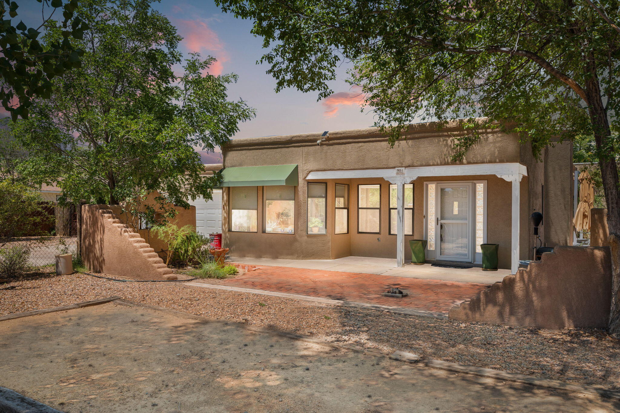 North Valley Dream that checks all of the boxes! Charming single story New Mexico Style home on a large gated lot with a guest house space, a sports pool, side yard access / RV parking and don't forget a brand new refrigerated ac system. Freshly painted! Newer Roof and Brand New garage doors & Custom Blinds. This home has it all with ceramic tile flooring, skylights, and a open remolded kitchen with granite counter tops, custom cabinets, and a Chefs oven. The owners suit is separate from the rest of the bedrooms and has a walk in closet, double sinks, large walk in shower and privacy toilet. Large heated & cooled guest house space Tons of storage. The backyard is perfect for entertaining with a large pool that has privacy, yard space, & covered sitting spaced.