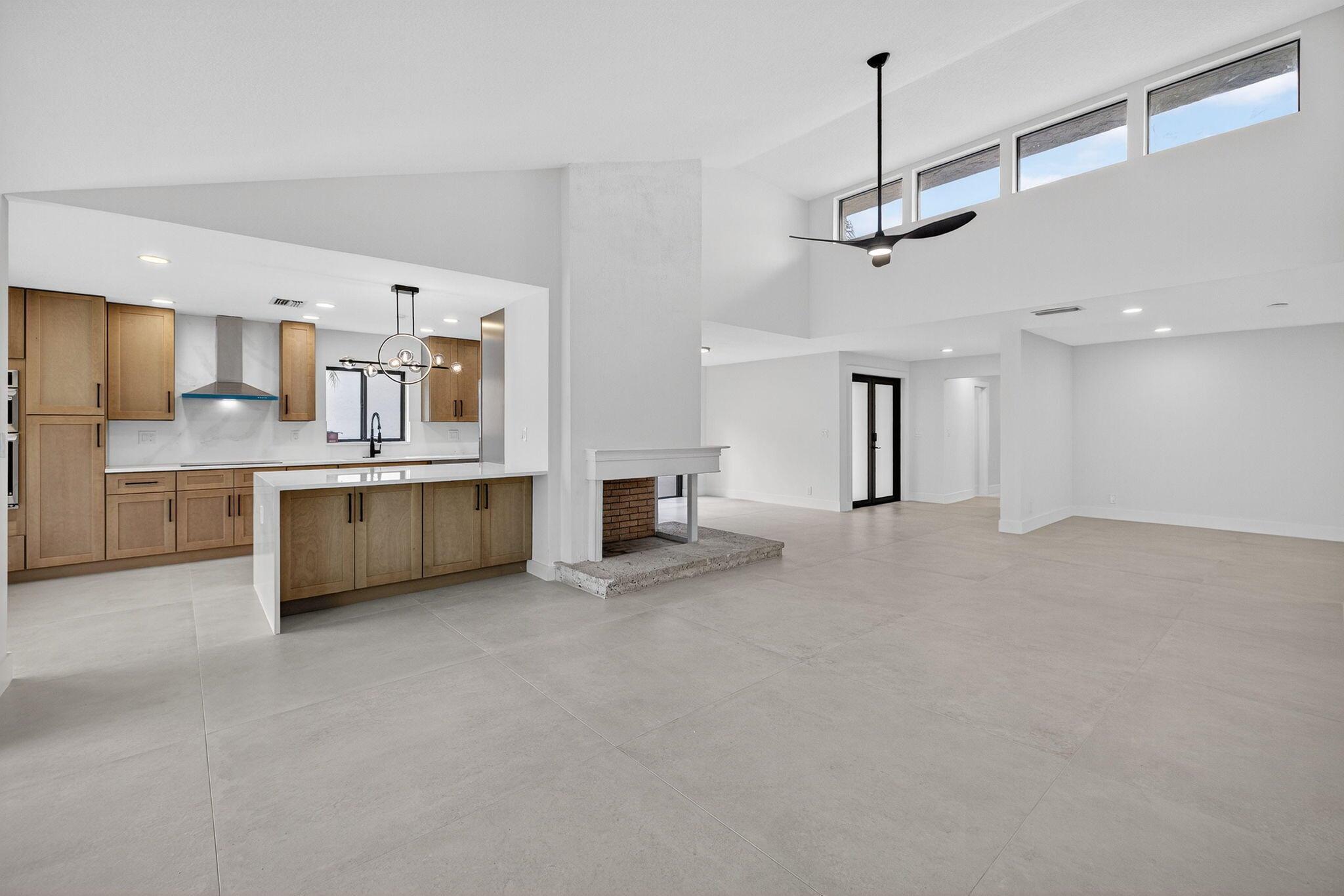 STUNNING FULLY RENOVATED HOME IN PRESTIGIOUS PRADERA! This single-story gem has been completely transformed with high-end finishes throughout. ALL IN 2025 NEW ROOF, NEW IMPACT WINDOWS, and gorgeous NEW ITALIAN PORCELAIN TILE create the perfect foundation. The gourmet kitchen features NEW CABINETRY, COUNTERTOPS & STAINLESS APPLIANCES. Both bathrooms have been beautifully updated with modern fixtures and finishes. NEW WASHER & DRYER included