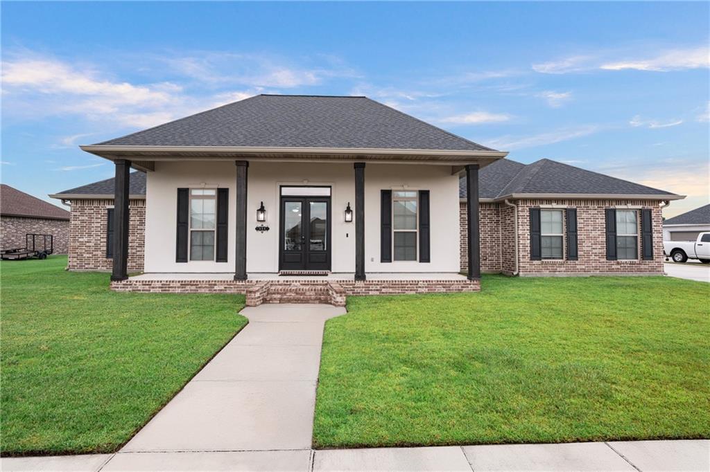 Gorgeous home, only 4 years young, complete with a heated saltwater POOL!

Step inside the grand entryway into the open concept living, kitchen, and dining area, with waterproof vinyl plank flooring throughout. The living room features tall ceilings, crown molding, a built-in entertainment center, and a brick fireplace. The kitchen is equipped with stainless steel appliances and a gas range, complemented by granite countertops, a farmhouse sink, and a walk-in pantry. The island with seating features a matching brick accent that ties seamlessly to the fireplace. Just off the entry, a bonus room with French doors provides an office, playroom, or flex space.

The primary suite showcases tray ceilings and a spa-like ensuite with dual vanities, a vanity desk, walk-in shower, soaking tub, and a spacious walk-in closet with dual entries. A split floor plan offers privacy, with two of the secondary bedrooms connected by a Jack & Jill bath. 

Enjoy outdoor living on the oversized covered patio with surround sound, overlooking the stunning pool and bulkhead. The aluminum fence carries a lifetime warranty, while the wooden fence is storm-rated.

Additional perks include a roof replaced after Ida, tankless water heater, termite contract, X-Flood zone with assumable policy, two-car garage, large driveway, and no HOA fees.

This home offers luxury, comfort, and peace of mind. Don’t wait and schedule your showing today!