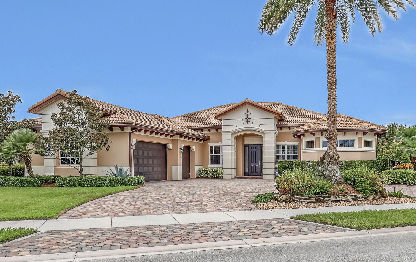 Experience lakefront living in the sought-after Stockton model, located in Jupiter's gated Rialto community. This 4-bedroom + office, 3-bath home sits on one of the largest double corner lots with panoramic lake views. Built in 2012-2013, it offers luxury plank flooring, CBS construction, impact windows, solar panels, and EV charging. The rear roof was redone 2 years ago, HVAC systems updated, and over $12K invested in drainage and landscaping. Features include custom closets, new garage doors with security cameras, automated lighting, and a full smart security system. Solar and electric water heaters, FPL energy-saving controls, and upgraded panel monitors enhance efficiency. Tucked in a quiet interior location with a circular drive and easy access to I-95 and the Turnpike. Energy efficiency continues with FPL power-saving boxes on the AC and water heater, an EV charging station, and manual control features to optimize utility usage. The main HVAC system was replaced 5 years ago, and the master suite's HVAC was replaced 3 years ago, ensuring year-round comfort.

Outside, enjoy a beautifully landscaped yard with over $12,000 in drainage and landscaping enhancements, automated landscape lighting, and a spacious circular brick paver driveway. The recently installed garage doors, motors, and rails are equipped with integrated security cameras, and the home includes electronic door locks and a full security system.

Perfectly positioned within the community for minimal traffic and maximum peace, this home provides quick access to both I-95 and Florida's Turnpike, while being minutes from Jupiter's top-rated schools, beaches, and dining.

This is a rare opportunity to own one of Rialto's most upgraded and private residences with both modern efficiency and timeless curb appeal.