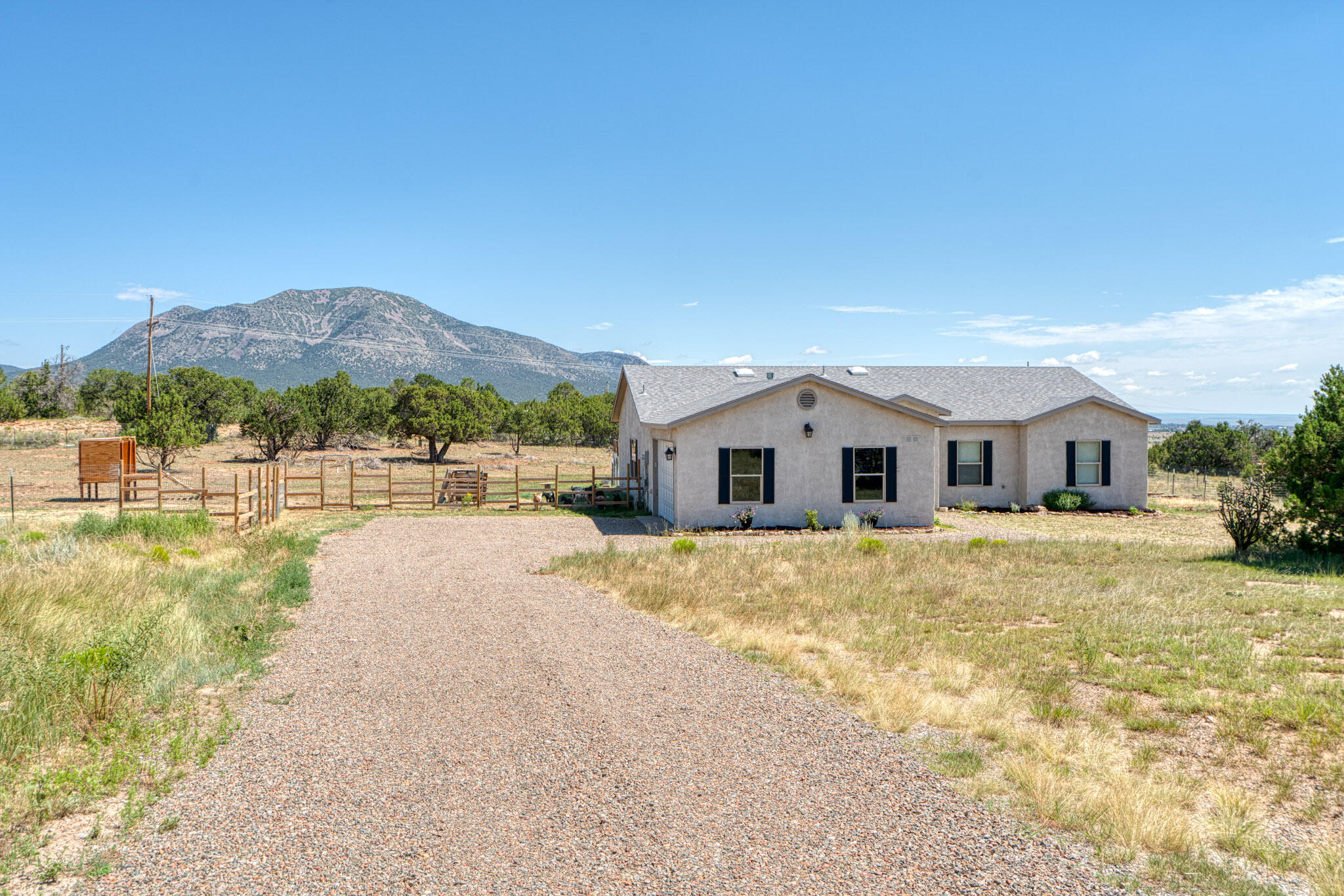 Set on 2.4 acres, this beautiful Edgewood home offers stunning views and plenty of space for horses or outdoor activities. Inside, you'll love the open floor plan with granite countertops and stainless steel appliances in the kitchen. The spacious primary suite features a walk-in closet, plus three additional ample-sized rooms. Don't miss this great opportunity to own a peaceful home in a scenic setting--schedule your private tour today!