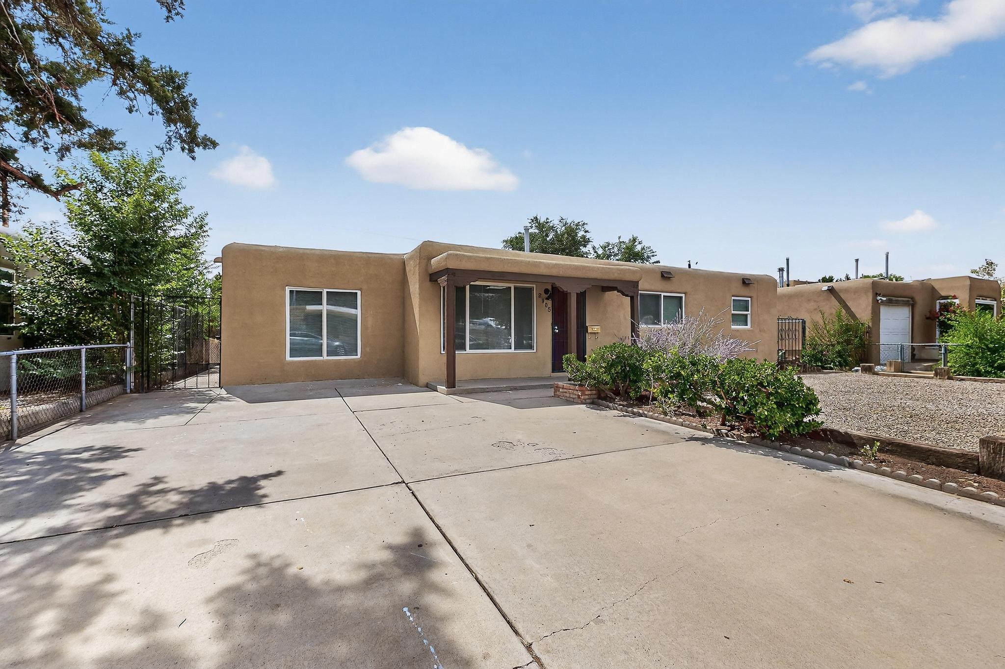 Fully renovated 3-bed, 2-bath beauty in Albuquerque's coveted Northeast Heights! This bright, open-layout home features luxury vinyl plank flooring, recessed lighting, fresh paint, and double-pane windows throughout. The chef-inspired kitchen boasts butcher block countertops, subway tile backsplash, soft-close shaker cabinets, and stainless steel appliances. The spacious primary bedroom lives like a private suite, offering a stunning double vanity, gold fixtures, and custom tilework. Every corner of this home has been thoughtfully upgraded with clean, modern finishes that create a welcoming, elegant vibe. Enjoy a large laundry/mudroom, gated front yard with extended driveway, and a generous backyard with room to relax or entertain. Close to parks, trails, shopping, & top-rated schools!
