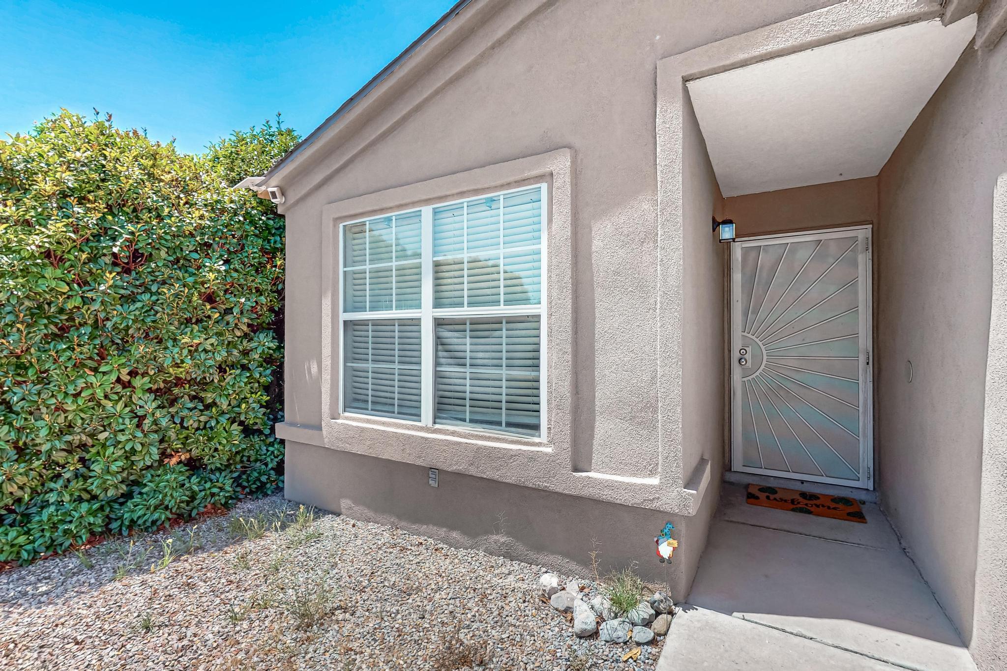 Welcome to 2105 Sea Foam St NW! This charming single-story home offers 3 bedrooms, 2 baths, an open-concept layout, and updated finishes throughout. The kitchen features light cabinetry, beautiful granite counters, big country style sink, stainless steel appliances, and a breakfast bar that flows into a bright dining area with patio access. The cozy living room includes plush carpet and large windows. Enjoy a low-maintenance backyard and a two-car garage. Conveniently located near parks, restaurants, shopping, and minutes from I-40 and Coors for easy commuting. Don't miss this move-in ready Westside gem!
