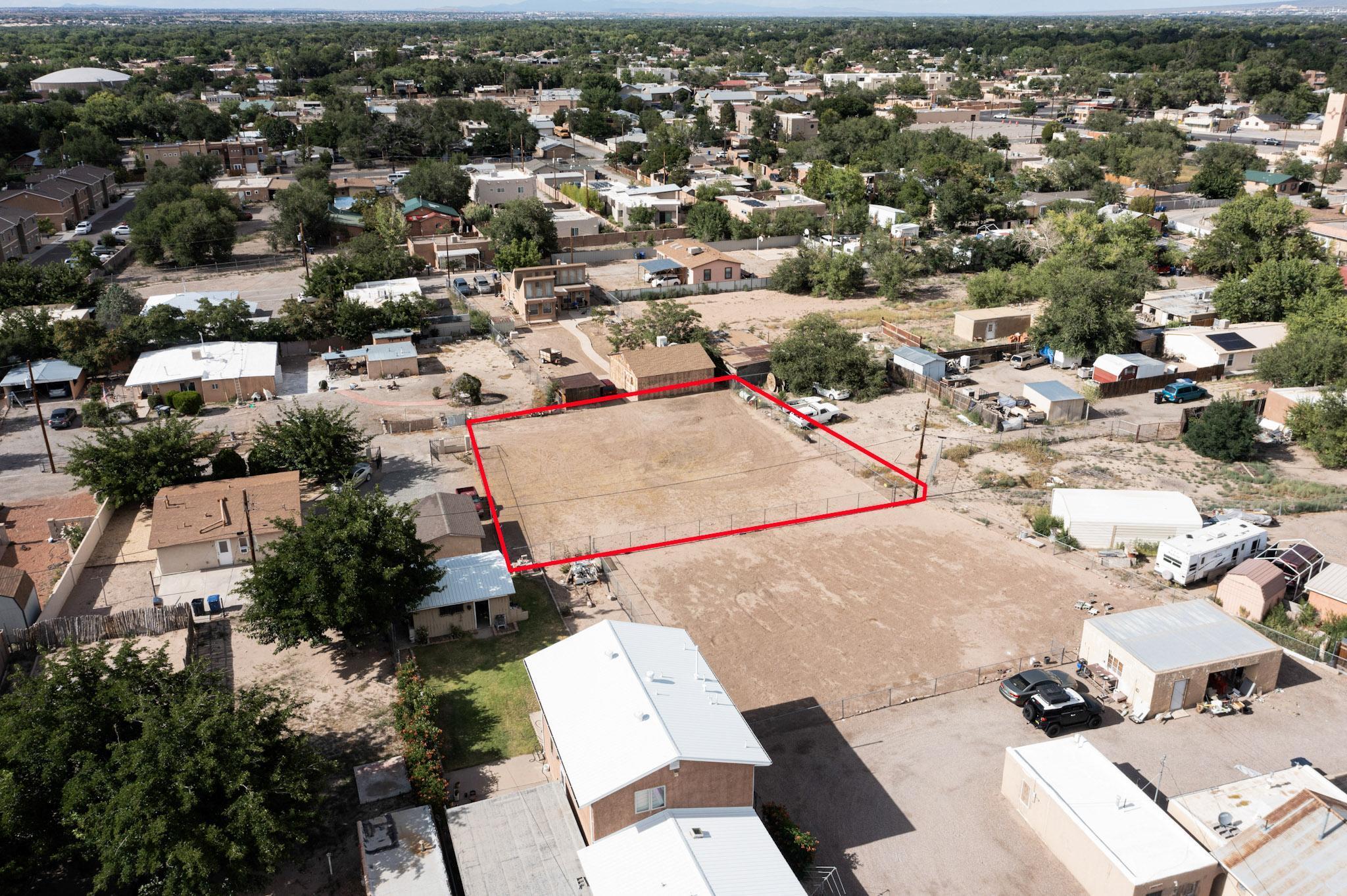 Located in the desirable Los Duranes neighborhood, this .23 acre lot offers a unique opportunity to build in one of Albuquerque's most charming and historic communities. Enjoy a peaceful residential setting just minutes from Old Town, Downtown, Rio Grande Bosque trails and I-40. The level lot is ready for your vision, with utilities nearby and no HOA restrictions. Surrounded by established homes and mature trees, it's the perfect setting for a custom residence or investment property in a central, sought-after location.