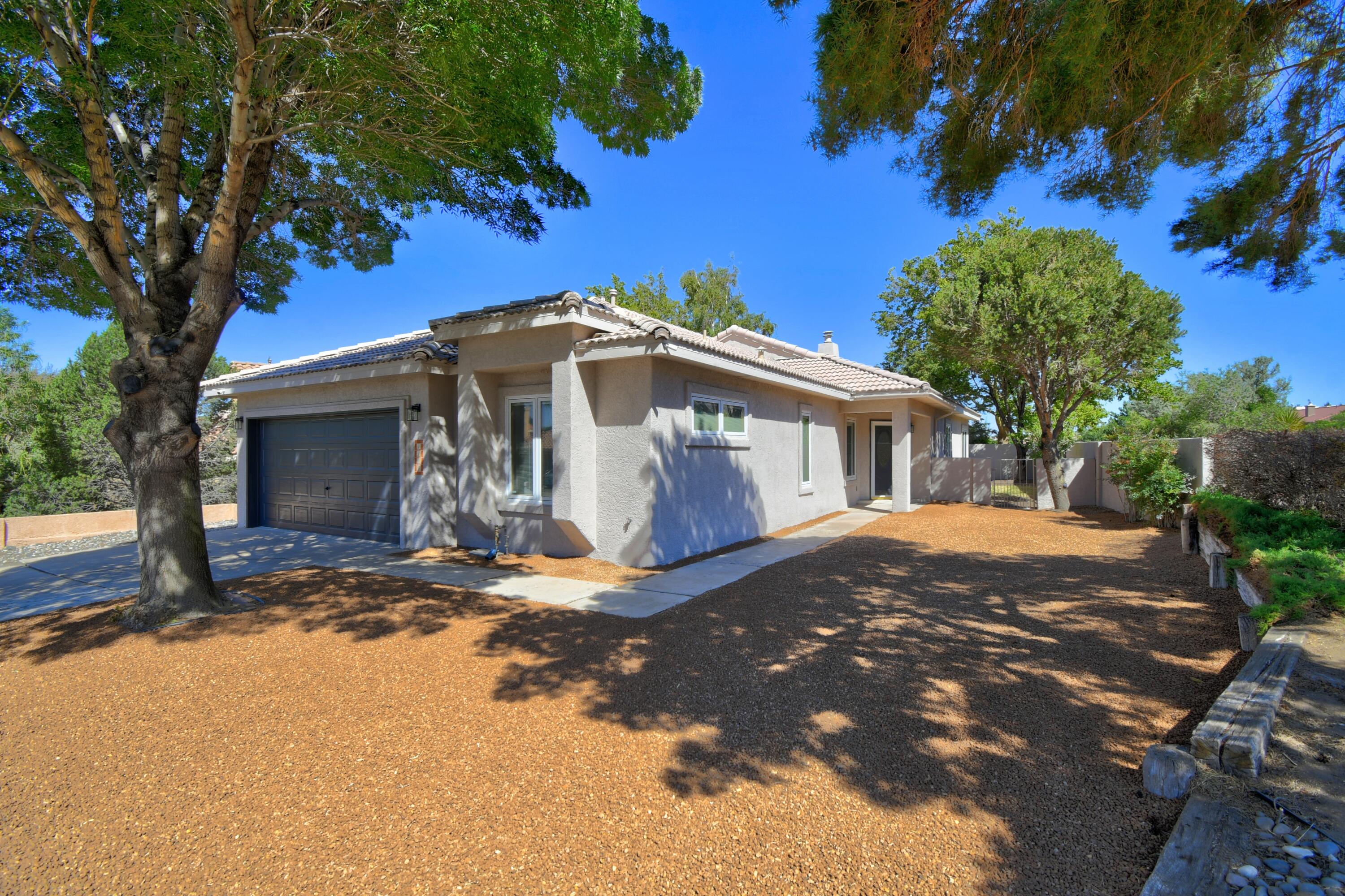 Beautifully remodeled home in a fantastic neighborhood, just 100 feet or so from the Embudo Foothills trail. This home features paid off solar that keeps electric bill incredibly low - last bill was only $12. The home has Pella windows along with fresh paint, new appliances, fixtures and water heater. Enjoy a spacious kitchen perfect for cooking, great entertaining space, a large Master bedroom, and other well sized rooms. The tile roof adds charm and durability and the landscaping has been done and is ready to go. This home is close to parks and outdoor adventures. Move-in ready with comfort and style throughout.