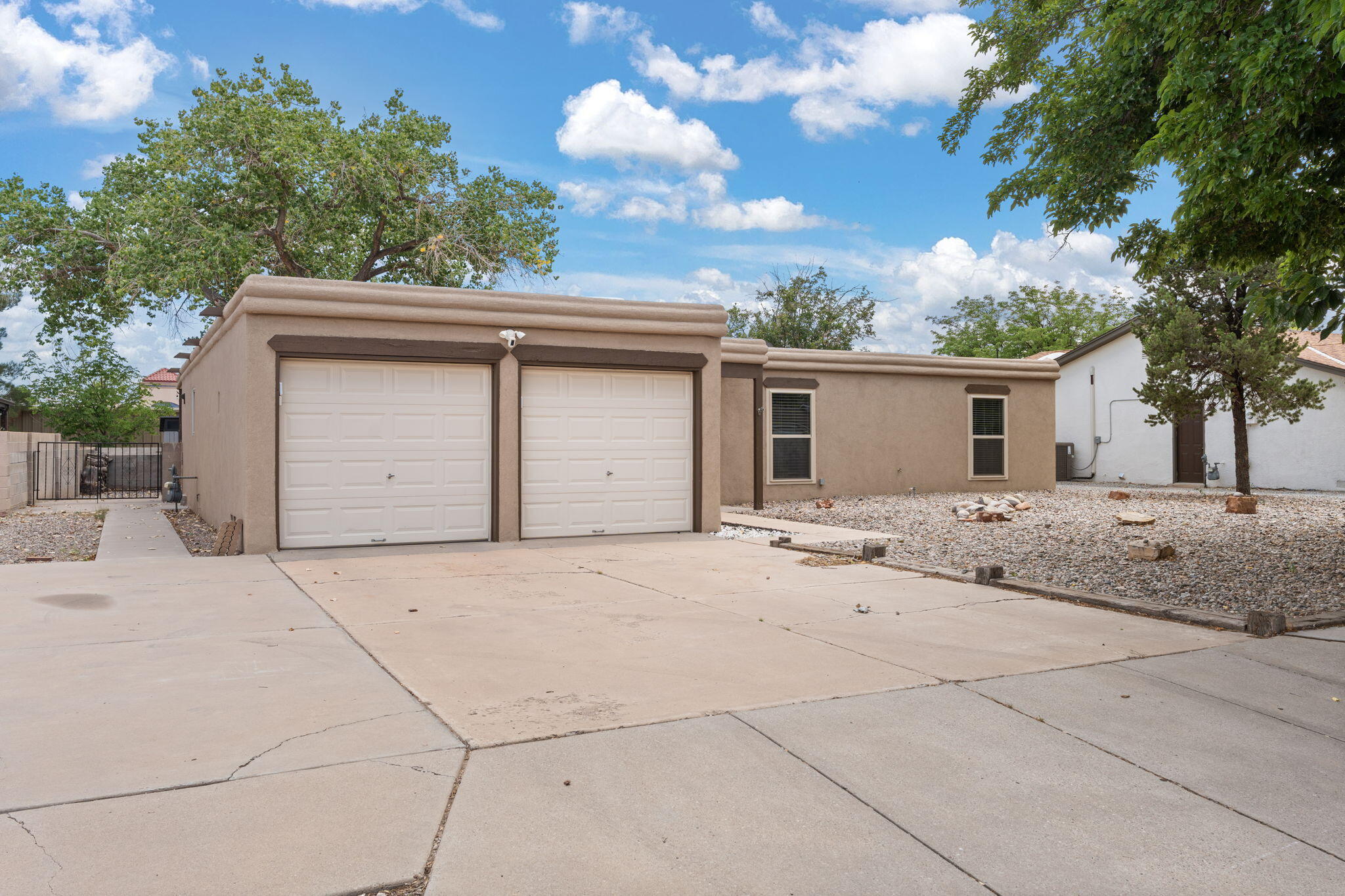 Beautiful single-story home in desirable Taylor Ranch featuring an open-concept floorplan with a cozy wood stove, newer windows, stucco, and refrigerated air. You'll love the remodeled kitchen with stainless steel appliances that stay, newer style tile in the primary bath, and newer carpet in the bedrooms. Landscaped front and back yards include a xeriscaped backyard with a covered patio, charming gazebo & shed.....perfect for relaxing or entertaining. There's also a large side yard with backyard access possible and extra parking for a third car or small boat. This well-maintained home is the perfect starter and is conveniently located near parks, schools, and dining. It's the perfect place to hang your heart!