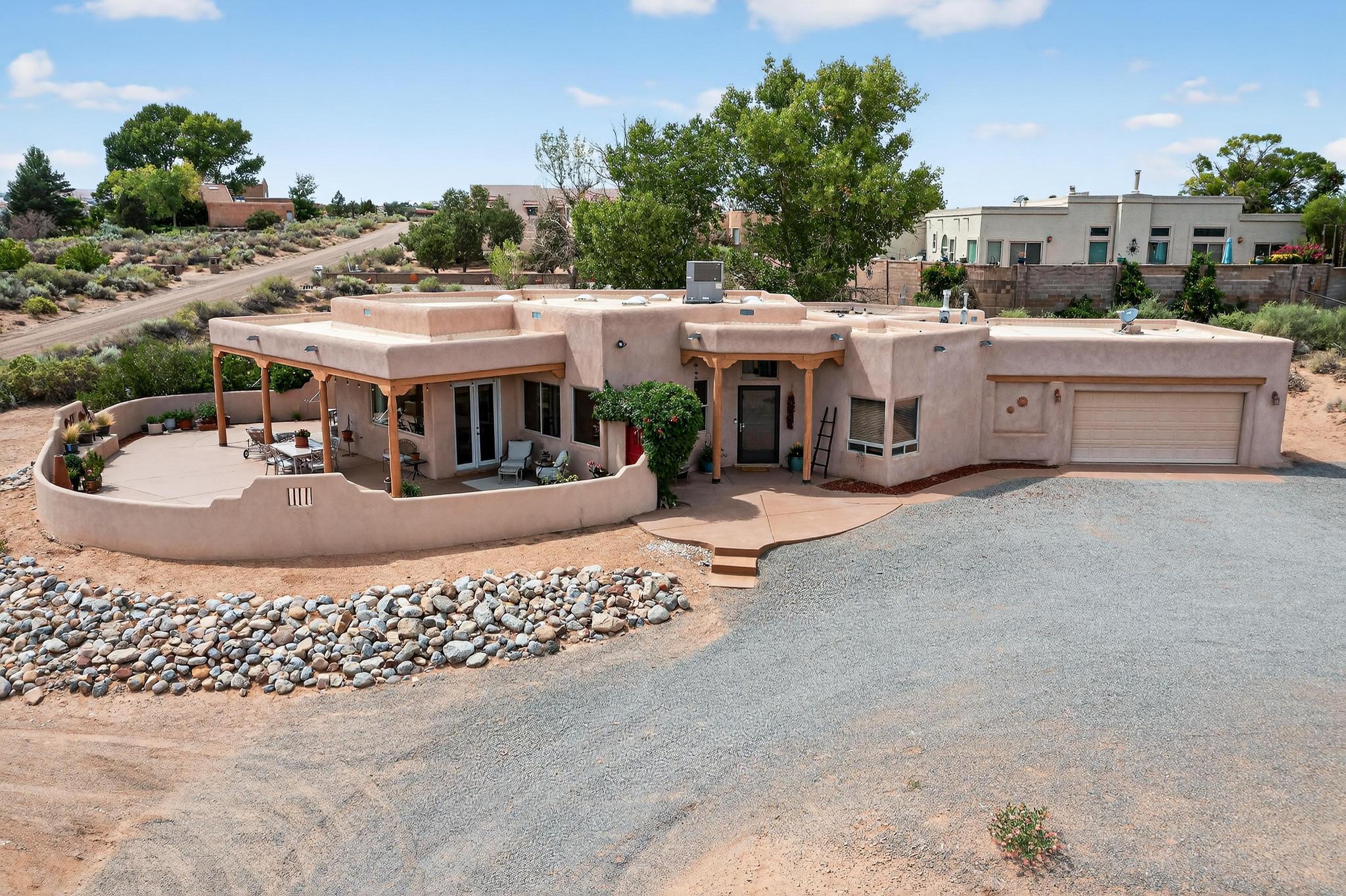 This stunning property showcases breathtaking views and a variety of premium features, making it a must-see! Home features a beautiful courtyard with inviting seating areas. Inside, you have an open floor plan with a spacious living area with floor-to-ceiling built-ins and a fireplace. Gourmet kitchen features ample workspace, custom cabinetry, granite countertops, and a pantry. Other features include: extra-wide doors for accessibility, a Water softener, and a reverse osmosis system, hardwood and tile flooring, skylights, wood blinds, radiant heat, and refrigerated air. The garage is oversized for ample storage. Large windows throughout to take in stunning scenery. Large windows throughout to take in stunning scenery.