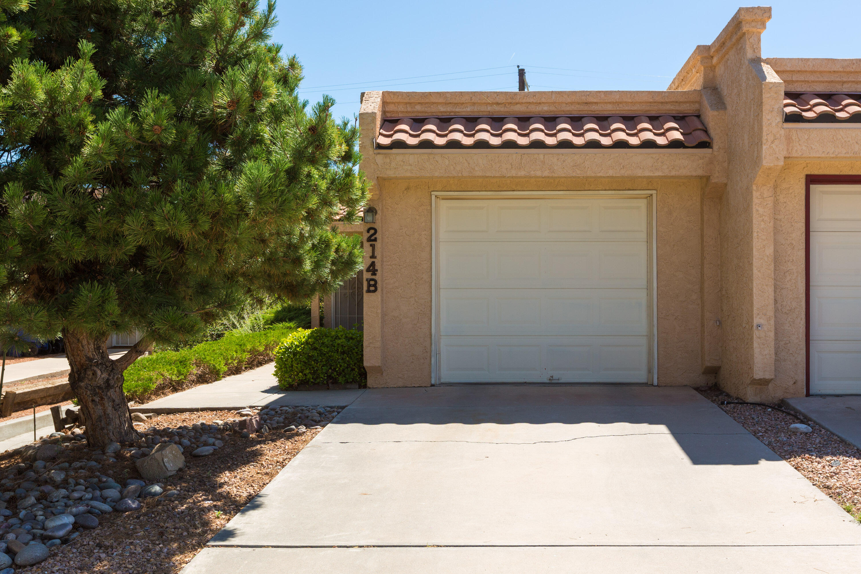 Welcome to this conveniently located townhome, close to everything!  The kitchen has Saltillo style tile flooring, vibrant Brazilian KOA hardwood in the living/dining area, integrated forced air AC/Heating unit installed in 2019! You'll love the spacious master bedroom with access to the backyard.  The secondary bedroom is also large, plus there's a laundry room.  The washer and dryer stay as well as the newer refrigerator...and did I mention the roomy one car garage?
