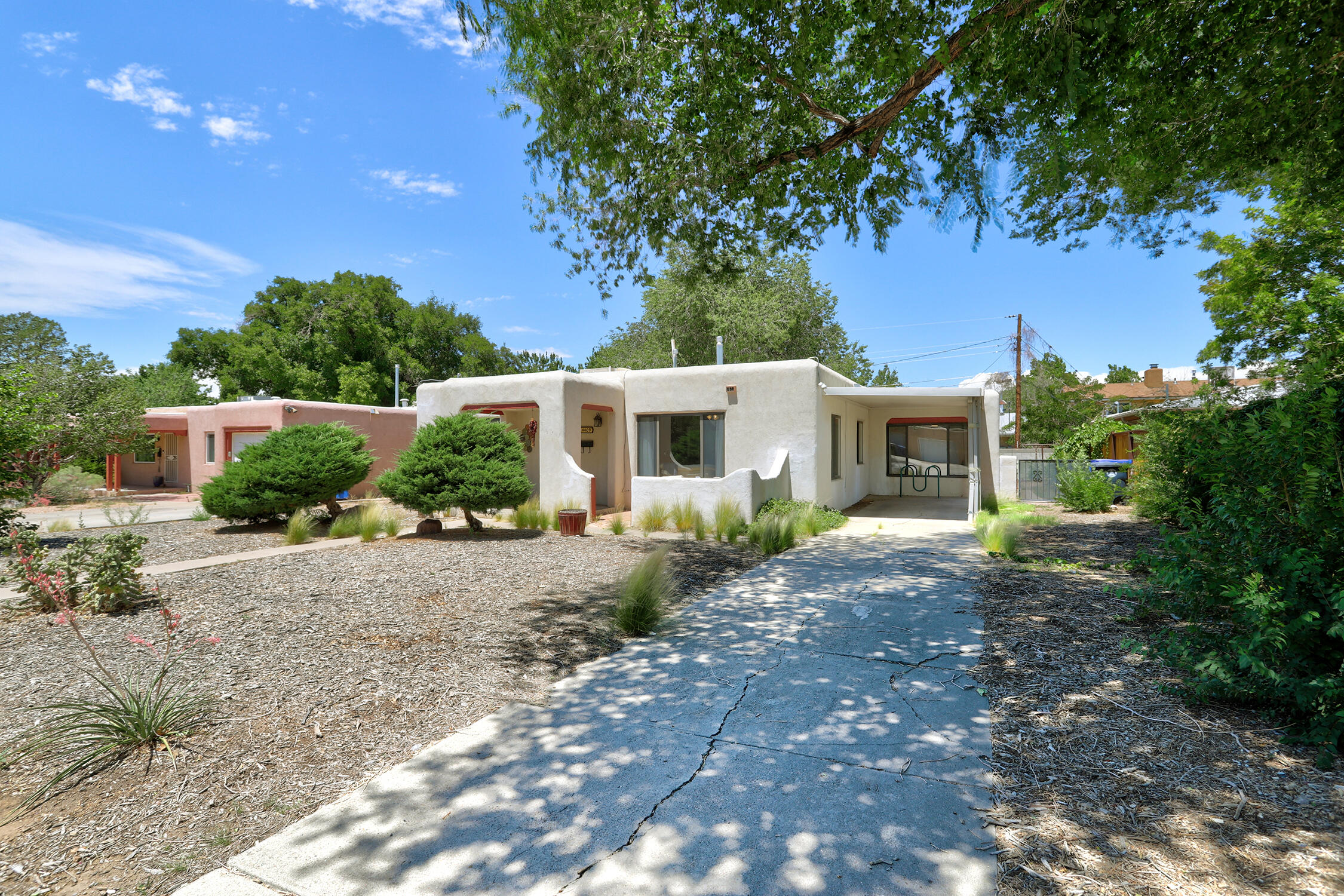 Charming and well maintained home in the heart of the UNM area, just minutes from Nob HIll! This 3 bed, 2 bath gem features beautiful hardwood floors and a spacious light filled layout.  Large primary suite with walk in closet is thoughtfully separated from the other 2 bedrooms.  Living/dining room combo and generously sized kitchen provide a comfortable and functional flow for everyday living and entertaining.  Private backyard features a covered porch and storage shed. Easy access to I40, Hospitals, University of New Mexico, local parks and many shopping and dining options.  Call for a private tour today!