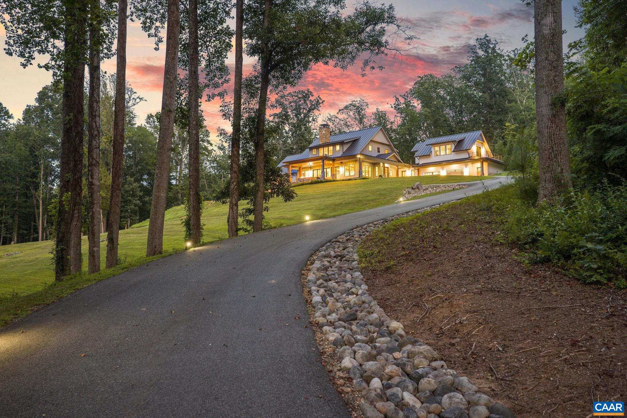 Sweeping Blue Ridge Views and Exceptional Design. A rare offering in Charlottesville’s premier Colthurst Farm neighborhood minutes from UVA, Historic Downtown and two Country Clubs. Set on 6+ private acres with just under 8,000 sf of living space and 1,700+ sf of outdoor porches and terraces, this custom-built estate captures sweeping Blue Ridge Mountain views from nearly every room. Thoughtfully designed for luxurious everyday living and grand entertaining the home features soaring ceilings, a breathtaking great room with wood burning fireplace and a chef’s kitchen with 6 burner Wolf range and Sub-Zero appliances and wine fridge. The main-level primary suite is a tranquil retreat with spa-like amenities and a huge closet with custom shelving. Additional highlights include a home office, library with gas fireplace and built-ins, a second primary suite upstairs, two ensuite bedrooms and a private guest suite/office wing. The terrace level offers a full gym, home theater, rec room with wet bar and guest suite. Outside, enjoy a covered terrace with built in gas firepit, heated saltwater pool with state-of-the-art automation, private terrace with jacuzzi hot tub and an outdoor shower. A stunning blend of privacy, elegance and views.