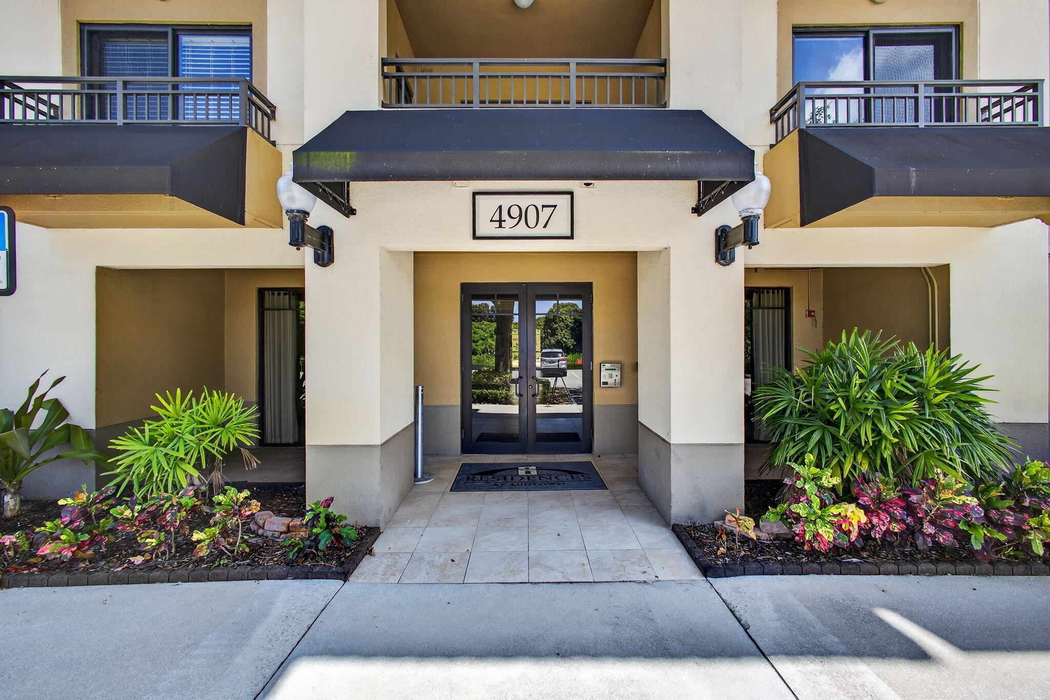 OVERLOOKING THE LAKE FROM THE TOP FLOOR AND FILLED WITH NATURAL LIGHT, THIS IMMACULATE AND WELL CARED FOR UNIT HAS BEEN CONVERTED FROM A THREE BEDROOM INTO A SPACIOUS TWO BEDROOM WITH HIGH VOLUME CEILINGS, CROWN MOLDING AND CERAMIC TILE.  THE SPLIT PLAN HAS A PRIMARY ENSUITE WITH SEPARATE SHOWER AND LARGE SOAKER TUB.  OPEN GRANITE KITCHEN WITH STAINLESS STEEL APPLIANCES.  LAUNDRY ROOM WITH NEW WASHER AND DRYER.  IMPACT GLASS ON ALL WINDOWS AND SLIDING DOORS OPENING TO LARGE COVERED BALCONY.  EXTRA STORAGE.  CLOSE TO ELEVATOR.  UNIT HAS ASSIGNED PARKING SPACE #4 IN ATTACHED COVERED GARAGE.   PET FRIENDLY.  TWO PETS, 60 LBS. LIMIT FOR ONE OR TOTAL WEIGHT FOR TWO. PERFECT LOCATION.  WALK TO RESTAURANTS AND THE FRESH MARKET. GREAT DINING AND SHOPPING.  CLOSE TO GOLF, MARINAS, & BEACHES.