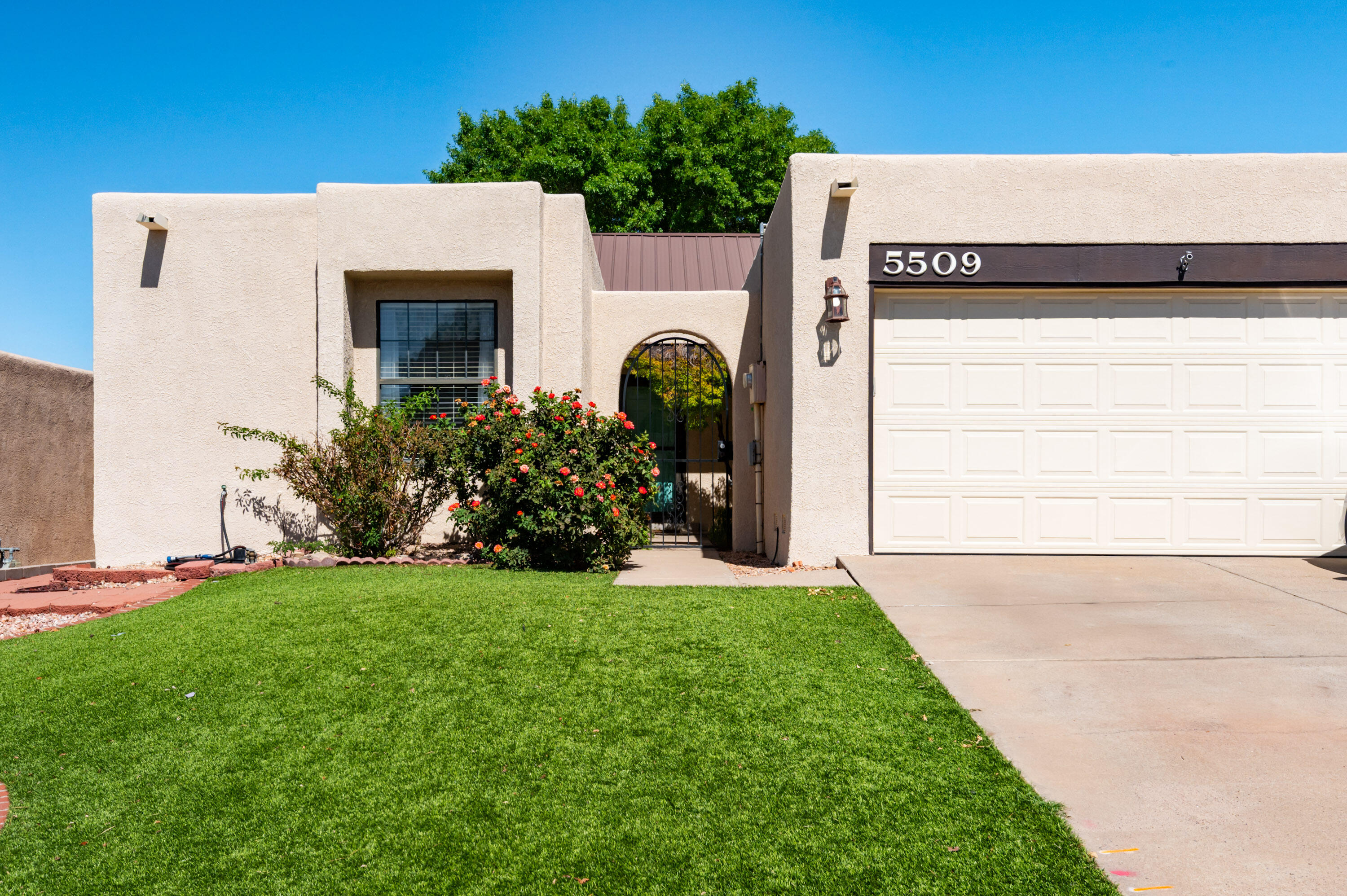 What a beautiful townhome with updates thru out.  3 bedroom with separation between the primary bedroom and the other rooms. 2 Full bathrooms.  Luxury engineered wood flooring in most of the home along with carpets in bedrooms and tile in kitchen and dining areas.  Backyard has tool cabinet along with covered patio and fenced in garden area.  Grass in back yard and synlawn in front.  Granite 12x12 tile in kitchen with Whirlpool appliances.  Vaulted ceiling in the main portion of the home.  Refrigerated AC for comfort.  Must see this one!