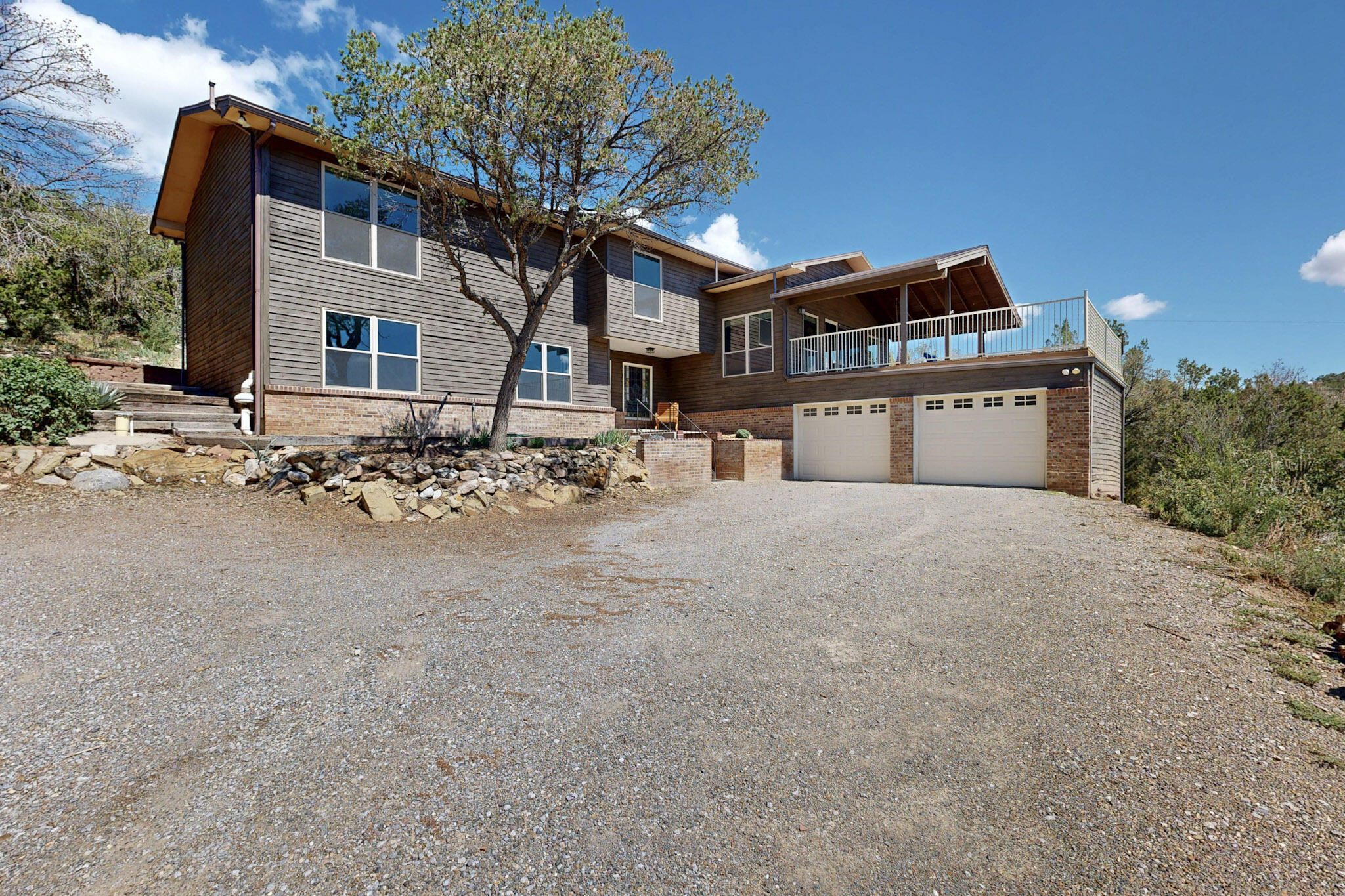This 4-bed, 3-bath, 2,769sqft home is an East Mountain gem boasting the best of both mountain views and convenience at just a short 10 minute drive to ABQ; an unparalleled combination! From the wood floors and exposed beams to the bright, natural light filling the kitchen and living room to the enormous patio doors out onto the huge deck with views for miles, natural beauty suffuses this entire property. The primary suite is complete with newly remodeled en-suite and generous walk-in while the living space is rounded out with three more bedrooms and two more bedrooms. Replete with amenities, including the extra large garage with space for all the necessary mountain accouterments, you won't want to miss this perfectly situated mountain retreat.