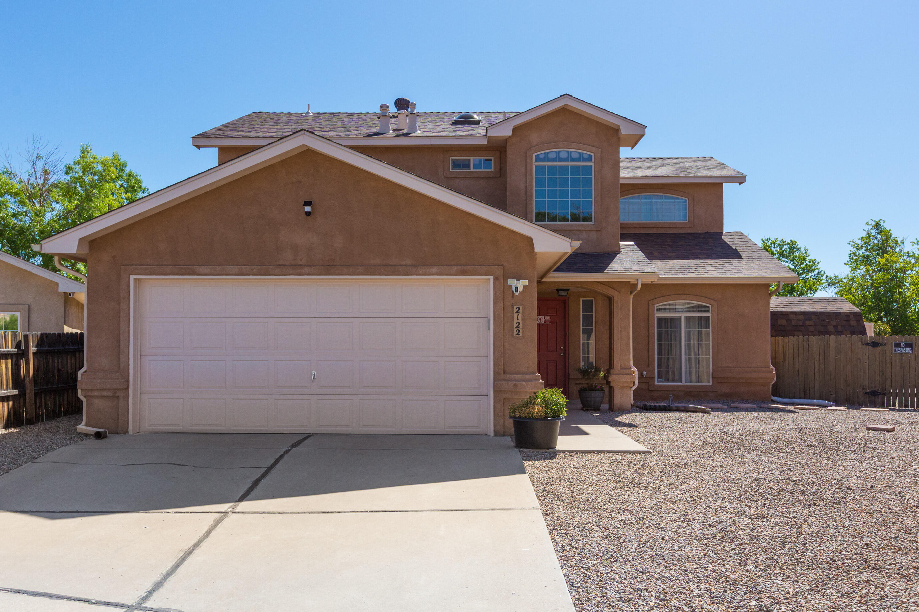 Come see this bright & open floorplan. Featuring 1800 sq.ft., 3 bedrooms, 3 baths, a large family room with a gas log fireplace. A formal dining room or can be used as a second living area. A spacious kitchen with ample cabinets & counter space and a breakfast nook. Primary bedroom has trey ceilings, an ensuite bath with a newly remodeled separate shower, garden tub, double vanity with a quartz countertop & 2 closets. Wake up to morning coffee & a sunrise from the balcony with phenomenal mountain views. Updates: paint, carpet, tile. Newer roof 2019, furnace & refrigerated AC 2022. Enjoy the large backyard with a huge covered patio, ceiling fan & misters. Great for entertaining. Easy & close access to I40, Unser & Coors Blvd, restaurants, employment, walking trails & the Ladera Golf Course
