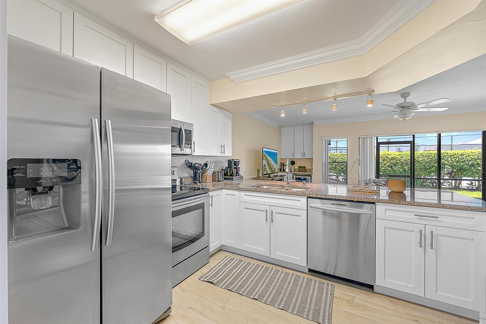 TURNKEY AND FULLY FURNISHED - bring your personal items and move right into this beautifully furnished, updated and upgraded, first floor 1-bedroom, 1.5-bathroom condo located just a short distance from the dog friendly Jupiter Beach. This condo has been updated with tile floors throughout, stainless steel appliances in the kitchen, built-in bar area with a wine refrigerator, updated bathrooms, stacked washer and dryer and so much more. Assigned parking spot, community clubhouse and pool, evening security and manager on site are just some amenities you'll enjoy. The highly desirable location in Jupiter is sought after for its proximity to the beach, restaurants and entertainment.  Don't miss this opportunity to own your piece of paradise.