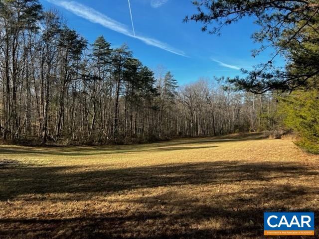 First time offered for sale in over 100 years. There are 5 division rights with the 22.26 acre plot. Roughly 1 acre is cleared, the rest is currently in forestry land use. There is approx 500 ft of State-maintained road frontage off Markwood Road and another 500 ft of State-maintained road frontage off of Lost Valley Road. Creek bed runs along the back side of the property. NO WALKING THE PROPERTY WITHOUT AN AGENT!