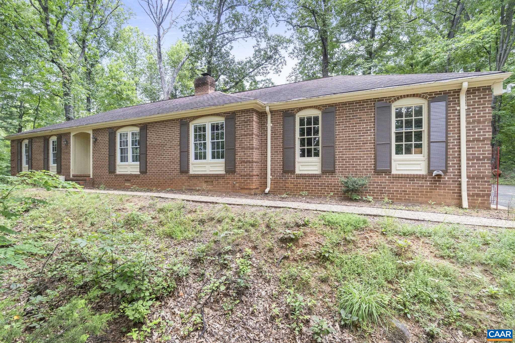 Discover untapped potential in the heart of Western Albemarle! Tucked away on 3 private acres with no HOA and true one-level living, this classic brick ranch offers a rare opportunity for the right buyer to bring fresh vision to a solid, well-loved home. With generous room sizes, a traditional layout, and no stairs, it’s ideal for all ages and stages—from first-time buyers to downsizers seeking main-level convenience.  The backyard invites dreams of lush gardens, evening bonfires, and peaceful mountain sunsets—all just minutes from award-winning schools, King Family Vineyards, and some of the region’s finest equestrian estates. Nestled at the foot of the Blue Ridge Mountains, this home is a quiet retreat with incredible potential.  Whether you’re looking for a place to renovate and customize or simply want a livable home in a prized location, this diamond in the rough is ready for its next chapter. With the right touch, it could shine as an elegant country haven.   Ask your agent about the Seller Credits offered at settlement!!!