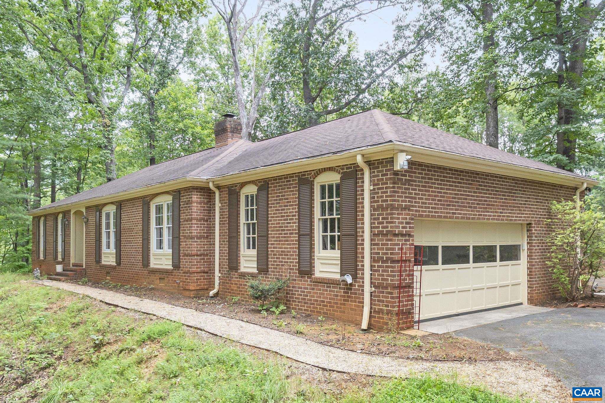 PRICE IMPROVEMENT!!! Discover untapped potential in the heart of Western Albemarle! Tucked away on 3 private acres with no HOA and true one-level living, this classic brick ranch offers a rare opportunity for the right buyer to bring fresh vision to a solid, well-loved home. I've included a few versions of possible improvements here in the photos! With generous room sizes, a traditional layout, and no stairs, it’s ideal for all ages and stages—from first-time buyers to downsizers seeking main-level convenience.  The backyard invites dreams of lush gardens, evening bonfires, and peaceful mountain sunsets—all just minutes from award-winning schools, King Family Vineyards, and some of the region’s finest equestrian estates. Nestled at the foot of the Blue Ridge Mountains, this home is a quiet retreat with incredible potential.  Whether you’re looking for a place to renovate and customize or simply want a livable home in a prized location, this diamond in the rough is ready for its next chapter. With the right touch, it could shine as an elegant country haven.