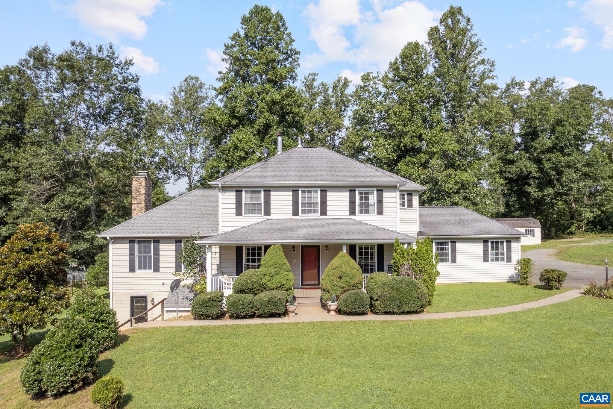 Situated on nearly 4 acres and offering over 4,000 sq ft of living space, this 4BD/3.5BA home blends rural charm with city convenience. The floor plan is ideal with 4 bedrooms and 2 baths upstairs, a cozy den with stone fireplace, spacious kitchen w/ breakfast bar and dining areas, plus a formal living or home office space. The walk-out basement features a rec room with kitchenette, separate entrance, and additional storage/flex space—perfect for guests or a potential rental. Outside, enjoy two fenced pastures, a meandering year-round creek, flat land for raised beds or chickens, ample wooded space, and a large yard to play or relax. Attached garage, storage shed, and a well-maintained home complete this exceptional opportunity. 10-15 minutes to Charlottesville, Wegmans, 5th Street Station - or 15 minutes the other direction hop over to Scottsville and the James River!