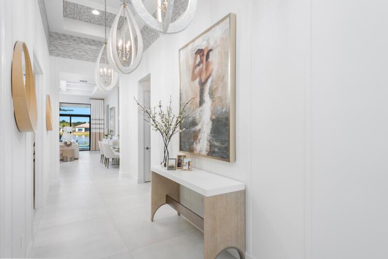 Rare opportunity to own the highly sought-after, designer curated fully furnished Venice Builder Model--luxury, location, and design in one. Situated on a premium lakefront lot w/ heated pool, spa, sun shelf, & summer kitchen. Features incl. a gourmet kitchen w/ oversized island, soaring ceilings, custom closets, designer window treatments, large-format porcelain tile+more. 3 Generous Bedrms, Plus Den/Office, Large Great Room, 31/2 Baths, Split 3-Car Garage, Heated Pool. Enjoy your private oasis+world-class amenities: full-service restaurant, 44,000 sq. ft. clubhouse with spa/salon, indoor/outdoor bar, indoor pickleball, tennis, multiple pools, & more. Closing cost incentives may apply-subject to change. Est delivery: 2nd quarter of 2026.