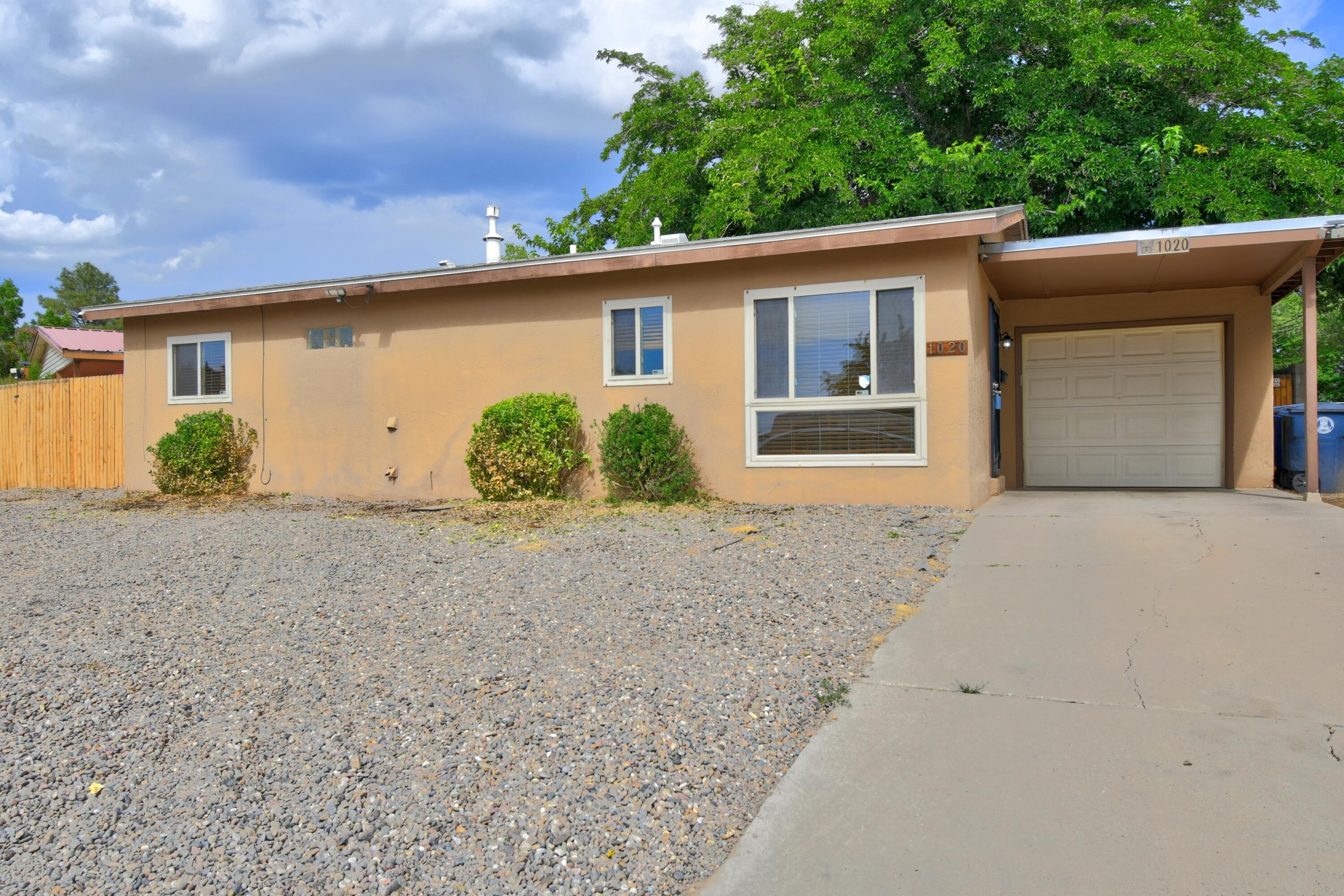 This is one you do not want to miss! This charming 3-bed, 1-bath home has countless upgrades, including ceramic tile flooring, Corian kitchen countertops, and newer appliances. Newer LED lighting throughout, plus a newer sliding glass door opening to a covered patio and spacious backyard with rear access. Refrigerated A/C and heater installed in 2012 with digital thermostat; system serviced and recharged in 2021. Roof (2021) on house and garages. Attached garage with opener plus separate detached garage--perfect for a workshop, man cave, or she shed. Great location near park!