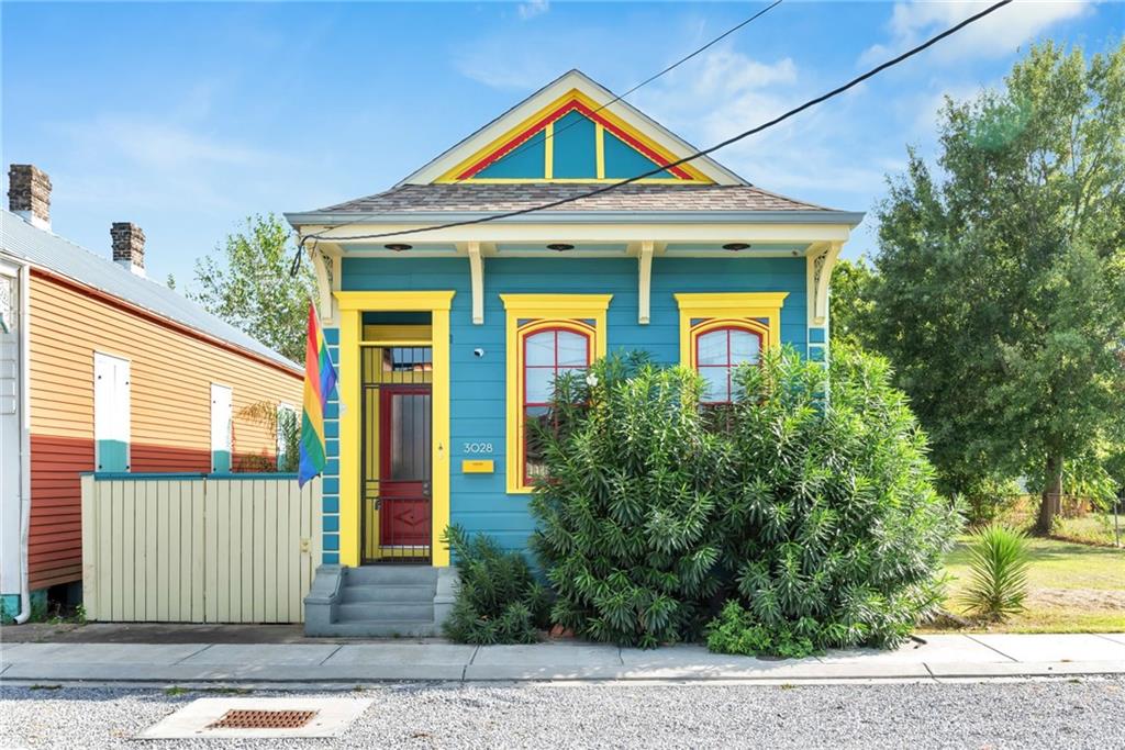 Charming Island-Inspired Italianate Shotgun in the Heart of Bywater.
Discover tropical tranquility in one of New Orleans’ most artistic and dynamic neighborhoods. This late-19th century Italianate shotgun has been fully renovated and thoughtfully updated - offering a rare blend of historic character and modern comfort. Inside, you’ll find 3 bedrooms and 1.5 bathrooms, soaring 12-foot ceilings, and three decorative fireplace mantels that reflect the home’s historic roots. French doors from the side gallery open into both bedrooms, creating a breezy, connected feel while offering picturesque views of the lush tropical garden beyond.
A rear deck provides the perfect spot for relaxing or entertaining, surrounded by greenery and intimate outdoor spaces. And with modern upgrades including Philips Hue smart lighting, a Nest thermostat, a 240V/50A EV charger, and a new ADT security system with four cameras and integrated smoke/CO2 detection, you’ll enjoy peace of mind and energy efficiency.
Additional features include: 
Central air & heat is approximately 4 years old. Roof was replaced in 2022. 
Potential off-street parking with minor fence modification
Included appliances: refrigerator, stove, washer/dryer, and backyard shed
Located less than a block from N7 and Harold’s Plants, this home is also just steps from the lively St. Claude corridor, where you’ll find local favorites like Galaxie Tacos, the legendary Saturn Bar, and Bud Rip’s Old 9th Ward Bar. Enjoy easy access to Bywater Bakery, Alma Café, and The Domino, or take a short walk or bike ride to Faubourg Marigny, Frenchmen Street, and the French Quarter.
This home is a rare Bywater find—rich in style, full of natural light, and perfectly located. Schedule a showing today and experience the magic for yourself. FIRST OPEN HOUSE. Tuesday, August 12 from 11am to 2pm. Light refreshments.