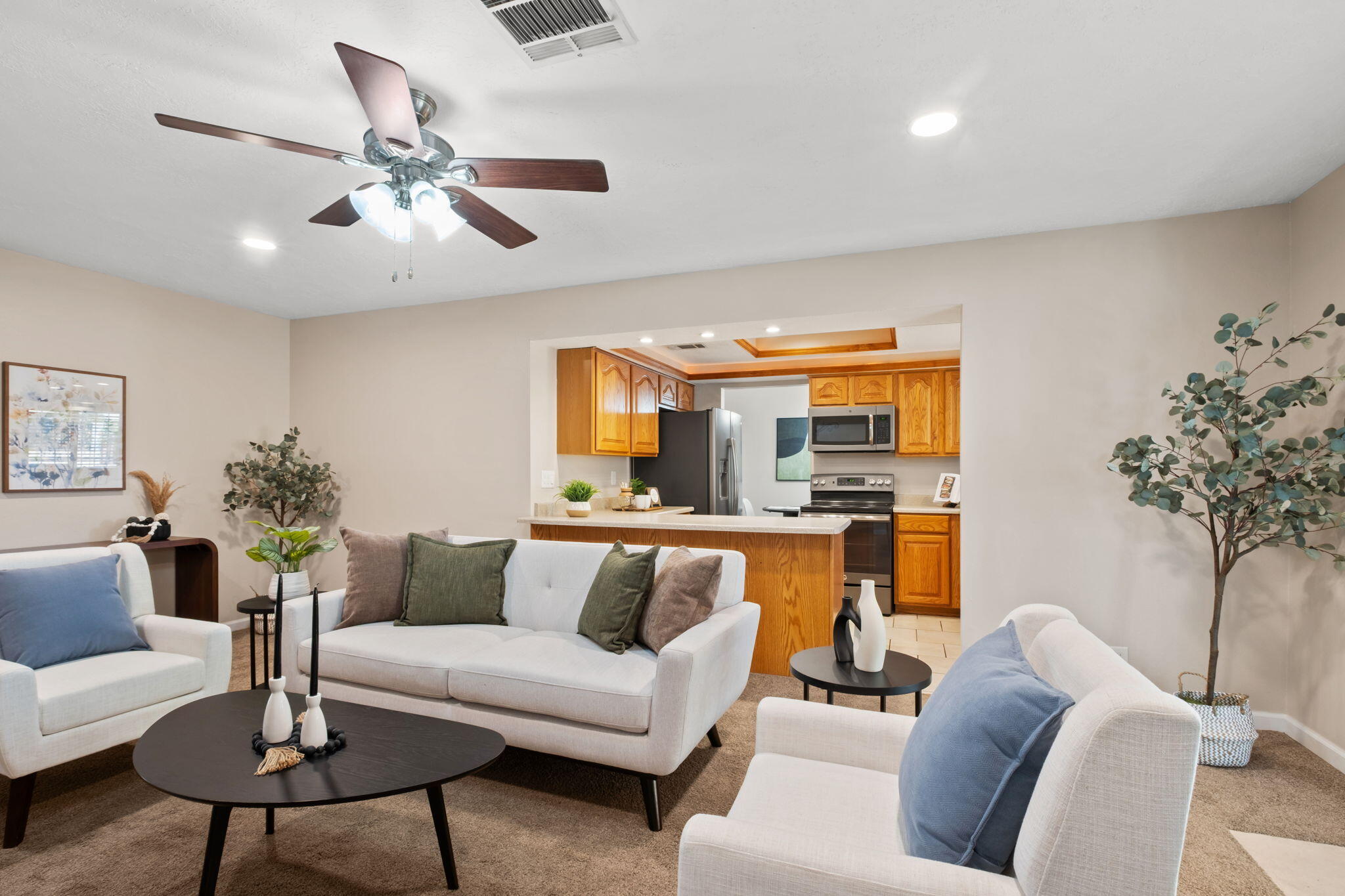 This beautifully updated Northeast Heights gem is sure to impress with 4 bedrooms, 2 spacious living areas, fresh paint, and new laminate wood flooring. Don't miss your chance to tour it during one of 4 open houses this Thursday, Friday, Saturday, and Sunday! The bathrooms have been tastefully upgraded with granite counters and tiled showers. Enjoy year-round outdoor living under the large covered patio complete with lighting and ceiling fans--perfect for entertaining or relaxing. Located within a few blocks of the Cherry Hills Library and Heritage Hills Park, you'll love the convenience of this desirable neighborhood.