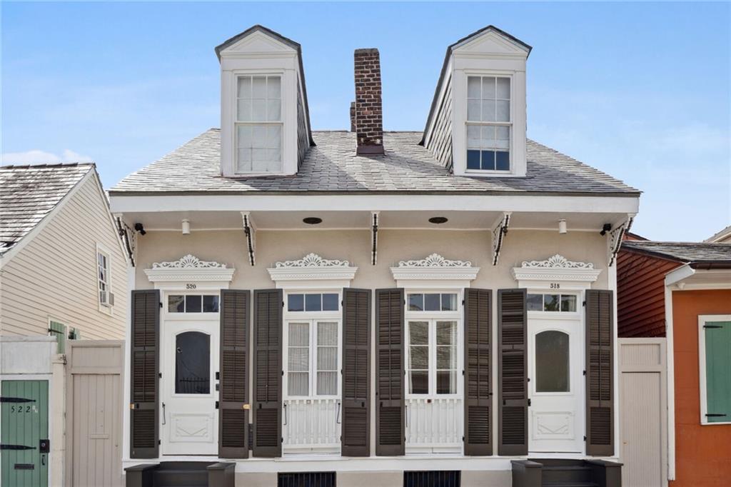 Welcome to 520 Burgundy St located in the Heart of the French Quarter. This lavishly appointed creole cottage has been reinvented with the finest of modern day conveniences while keeping its historic charm including original hardwood floors, exposed brick walls & high ceilings. No detail spared in this renovation including luxurious finishes, new fixtures, roof, electrical, plumbing & HVAC. The Kitchen has been completely remodeled & modernized with an entire ensemble of Thermador Appliances, including 6 burner range, drawer microwave, ice maker & wine fridge.

Exquisite design choices have been used throughout: stucco fireplaces, ornate lighting, stone floating vanity and custom drapery are just a few. Exposed brick & stucco fireplaces provide functionality & ambiance.

Thoughtfully located away from entertaining areas, the first floor primary suite provides a serene escape with sun dappled views of vine covered walls. The luxurious spa like en suite bath has a spacious walk in shower, freestanding tub, double vanity & French door access to pool. Not to be outdone, the primary suite also includes an enormous walk-in closet for all your needs.

Residence also features three beautifully appointed guest suites, each with ensuite bath. Located just off the foyer, the first exudes architectural charm with tall ceilings, fireplace, and exposed brick walls.  Upstairs are two elegant guest suites each with beautifully restored original wood ceilings, ultra-luxurious en suite baths, rooftop views & large walk-in closets.  

A conveniently located powder room with custom stone floating vanity & separate fully equipped laundry room are also found on the first floor.  

Outdoor living & entertaining is at its finest in the pool area with its luxurious bath plus storage space located just off the beautiful private flagstone courtyard with saltwater pool & waterfall surrounded by tall vine draped brick & masonry walls for the Quintessential French Quarter experience.