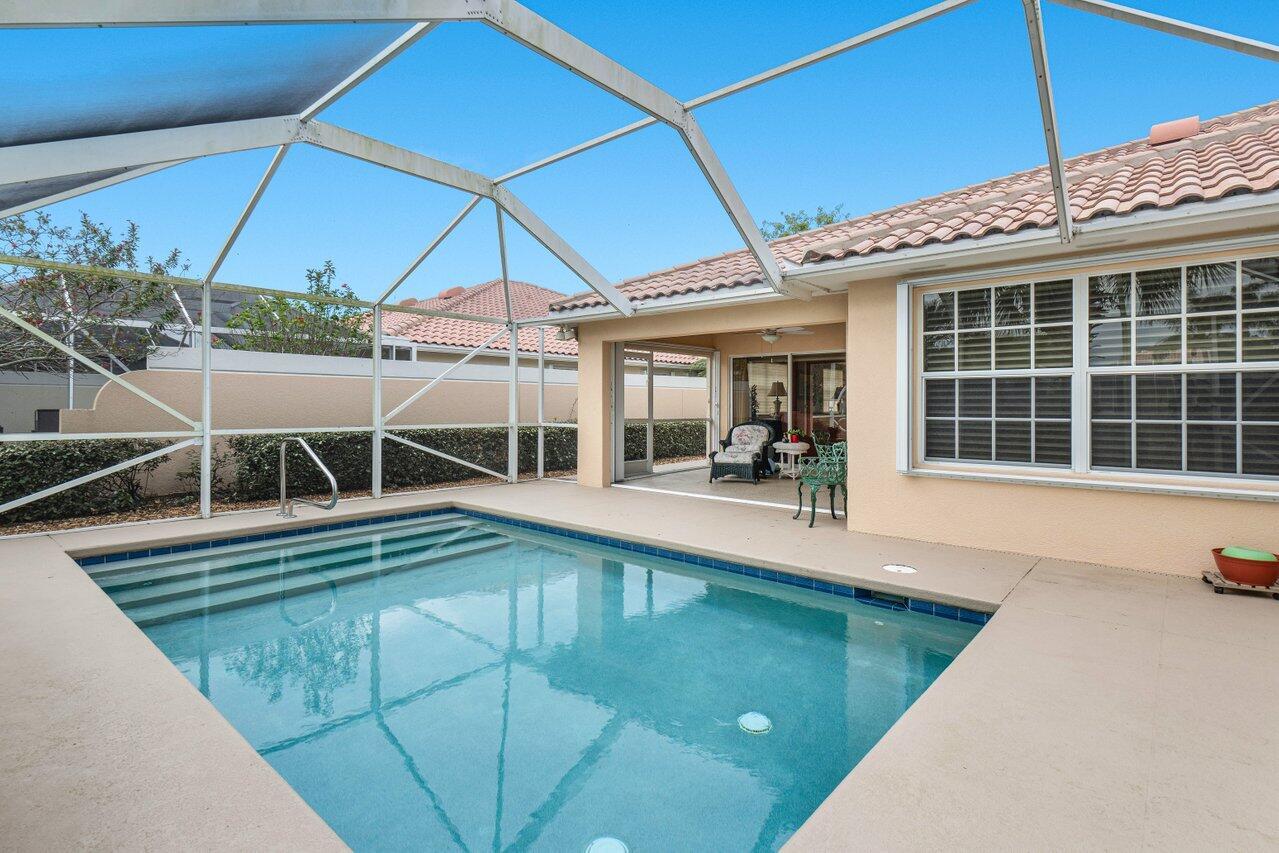 Welcome to Villagewalk. One of the best kept secrets in Wellington. Enjoy a Country Club Atmosphere without the expensive membership dues. This two bedroom two bath Capri Model is the only Capri available at the moment with a private pool. This immaculately kept home offers beautiful water and pool views. All window and doors have accordion shutters offering storm protection and will give you a break with your property insurance premiums.  The AC was replaced in 2021, a new pool pump in 2022, New Refrigerator in 2023, New Hot Water Heater in 2023, a new dishwasher in 2023.  Truly an opportunity not to be missed.