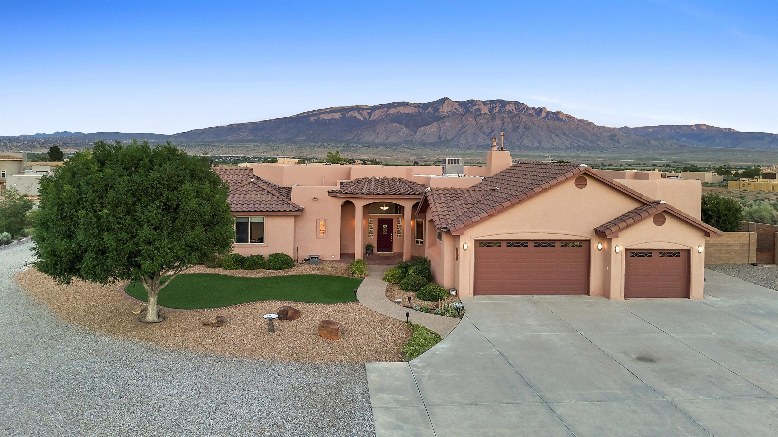 Fall in love every day with sweeping Sandia Mountain views--watch them transform into their famous watermelon glow from your private, sparkling pool or the comfort of your living room. This beautifully crafted 4-bedroom home features a spacious living area and 2nd Flex Family Den, 2 luxurious primary suites, and a chef's kitchen with high-end appliances and custom cherry cabinets. Nestled on 1 private acre with Pride of ownership is evident throughout, offering peace of mind and effortless elegance for many years to come. Generous 3-car garage, thoughtful bright, open/popular layout, breathtaking views, exceptional comfort, inviting spaces. Plus, seller is offering $10K in Flex Cash to personalize your home or buy down the rate and save thousands! Priced very well, come fall in love!
