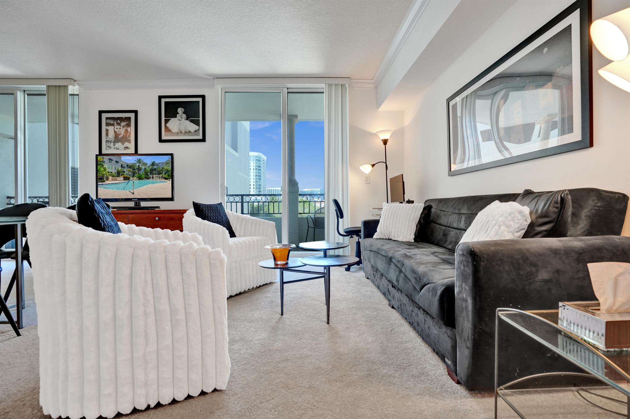 One of a kind Turnkey Fully furnished and move-in ready gem with low maintenance fees. This spacious studio at The Prado offers stylish upscale living in the heart of downtown. Unique rare 25-foot private terrace, ideal for outdoor dining or entertaining . A built-in queen Murphy bed maximizes your living space. A Dining area for more formal meals. The kitchen has stainless steel appliances, a granite island including additional Lucite seating.  Separate utility room for washer & dryer. Parking is located on the same floor close to the unit for easy access. The Prado offers resort-style amenities including a courtyard pool & spa, fitness center, and a clubhouse. Located just a short distance from Palm Beach, CityPlace, Clematis Street, Palm Beach Atlantic University, and Brightline.