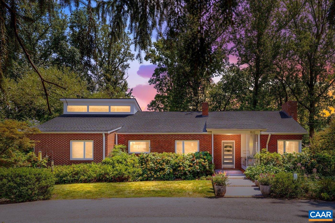 This beautiful Meadowbrook Hills home offers true main-level living with thoughtful design focused on accessibility, comfort, and high-end finishes. The spacious primary suite is a luxurious retreat w/ generous walk-in closet with laundry, a spa-inspired zero entry wet-room bath with rainfall and multi-directional showerheads and heated floors. The stylish kitchen offers modern style, stainless steel counters & appliances, a panel-front fridge.  Luxury hall bath with heated floors, a large living / dining spaces and 2 more BR on main floor.   Downstairs, the finished basement includes a fully equipped apartment with kitchen, bedroom, full bath, and separate utility meter—ideal for a caregiver, guests, or additional income.   Additional features: electric car charger, two fireplaces, multi-zone HVAC, and extensive smart-home functionality. Storage is abundant, with walk-up attic and a unfinished basement areas. Enjoy tranquil outdoor living with a Brazilian Ipe wood deck and screened porch, lower-level patio, and professionally landscaped gardens with year-round blooms, outdoor lighting, and a circular driveway.   Minutes to C'ville - enjoy premium comfort and accessibility in one of the city’s most desirable neighborhoods.