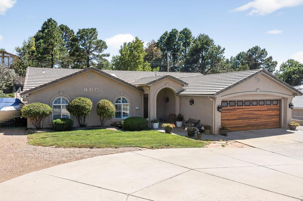Discover your new home in the desirable Four Hills neighborhood, featuring a well-maintained residence set on a large 1/4 acre lot. This spacious layout boasts 5 bedrooms and 3.5 baths, with a dedicated in-laws quarters thoughtfully located on a separate side of the house for added privacy. Enjoy a cozy office space, a generous living room, and a big kitchen with ample counter and cabinet space, perfect for family gatherings. The large backyard offers endless possibilities for outdoor enjoyment, while the property's great curb appeal enhances its charm. With refrigerated air conditioning and additional parking for a camper or boat, this newer construction home is conveniently located near a golf course and country club. Welcome Home!